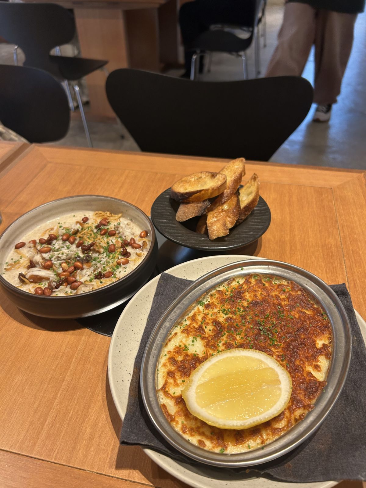 Smoked fish congee, coconut milk with nasi lemak condiments, and a smoked fish rillette with baguette chips