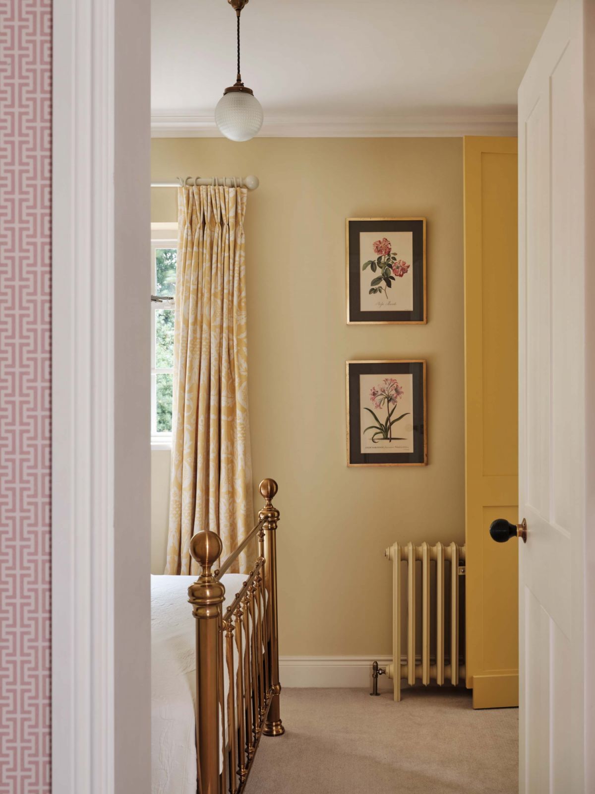 The yellow bedroom in this St Albans, England family home designed by Lucinda Sanford