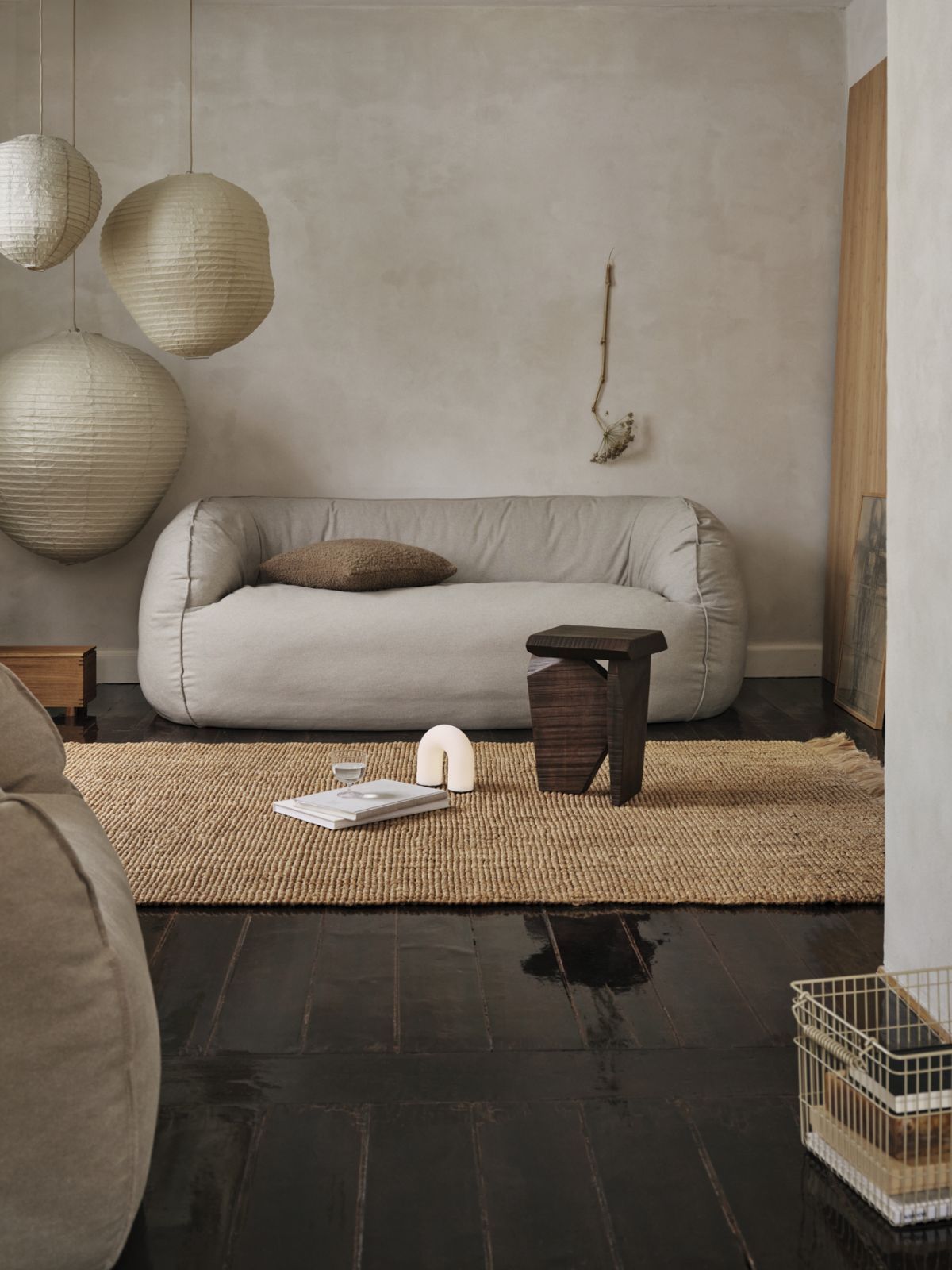 Lighting becomes a focal element in warm minimalist design with paper pendant lights introducing organic shapes and diffused illumination (Photo: Fermliving)