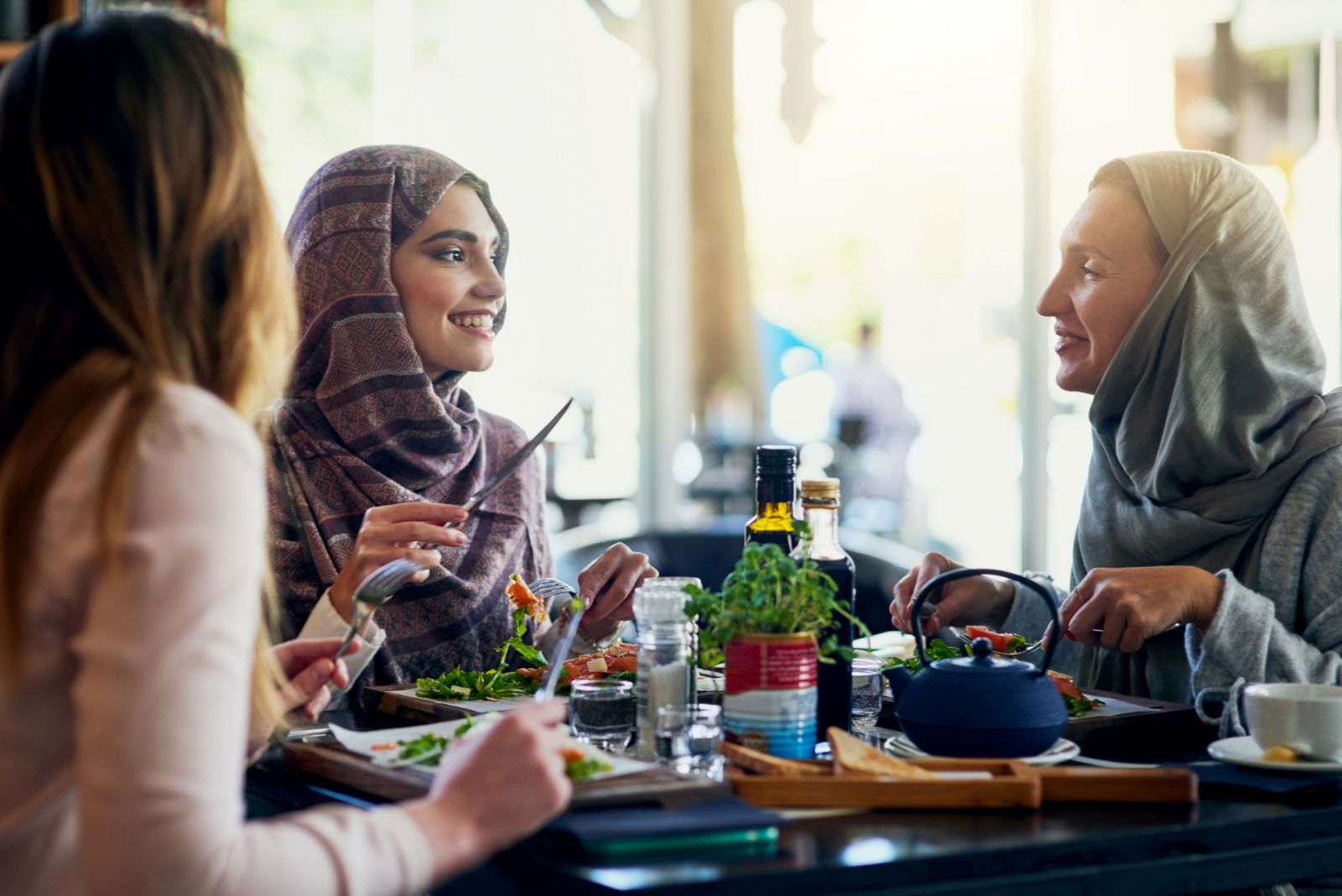Shot of a group of women getting together for lunch in a cafe