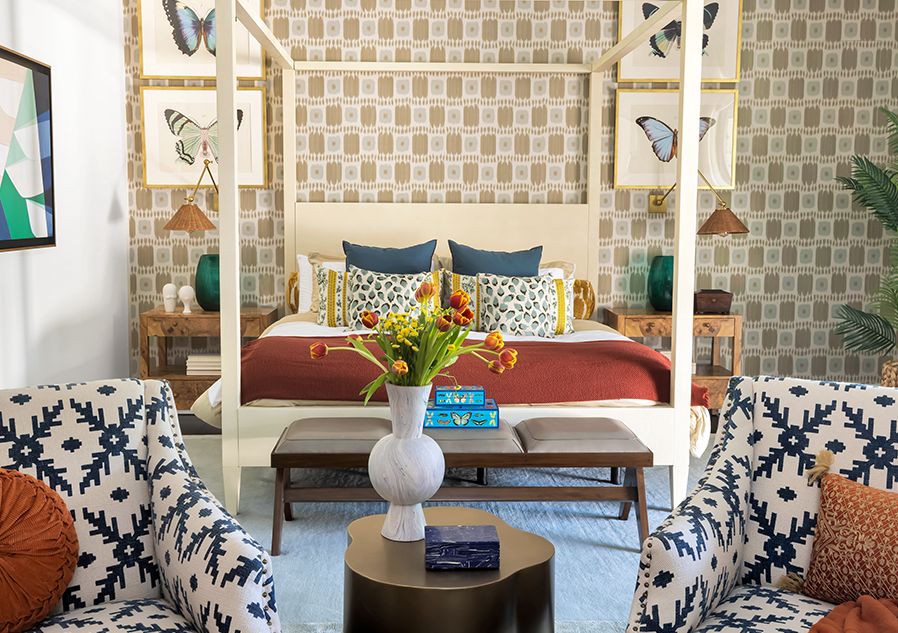 Layering jewel tones with patterned wallpaper and chairs in a room by mr alex TATE