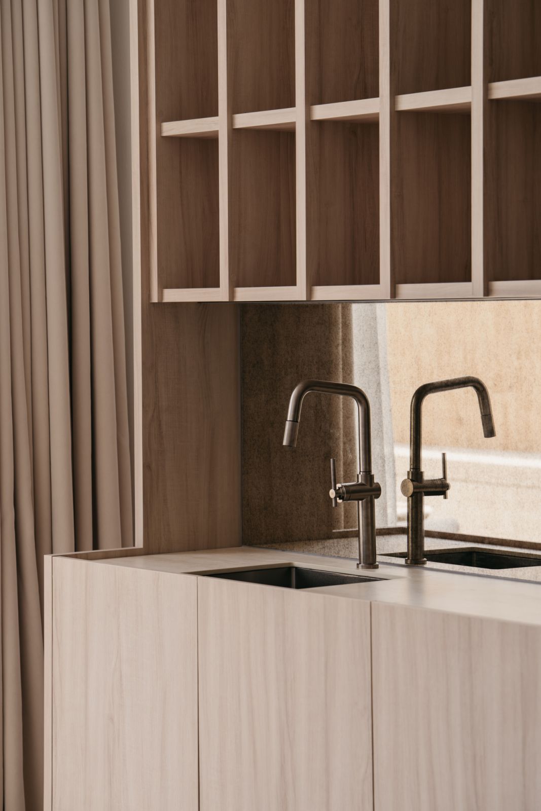 Minimalist kitchen featuring premium veneer cabinetry and brushed metal fixtures in Penang waterfront home renovation