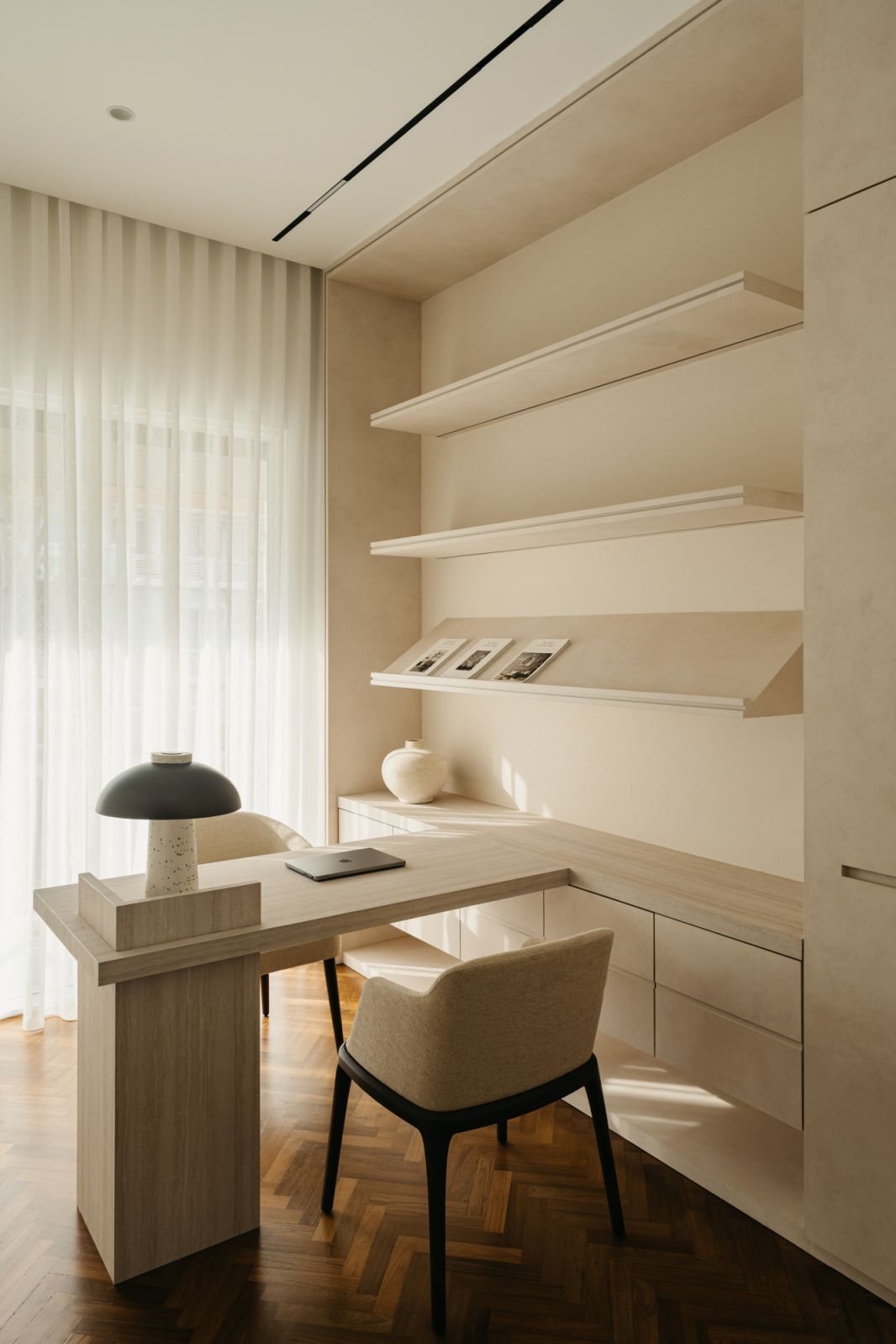 Light-filled workspace featuring a bleached wood desk, a contemporary dome lamp and custom joinery