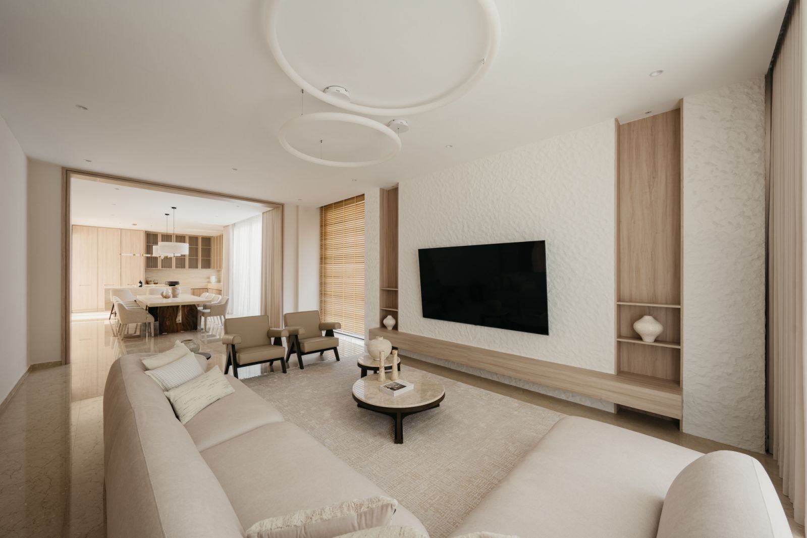 Contemporary open-plan living area with sculptural ceiling fixture, textured wall treatment and floating media console in neutral palette