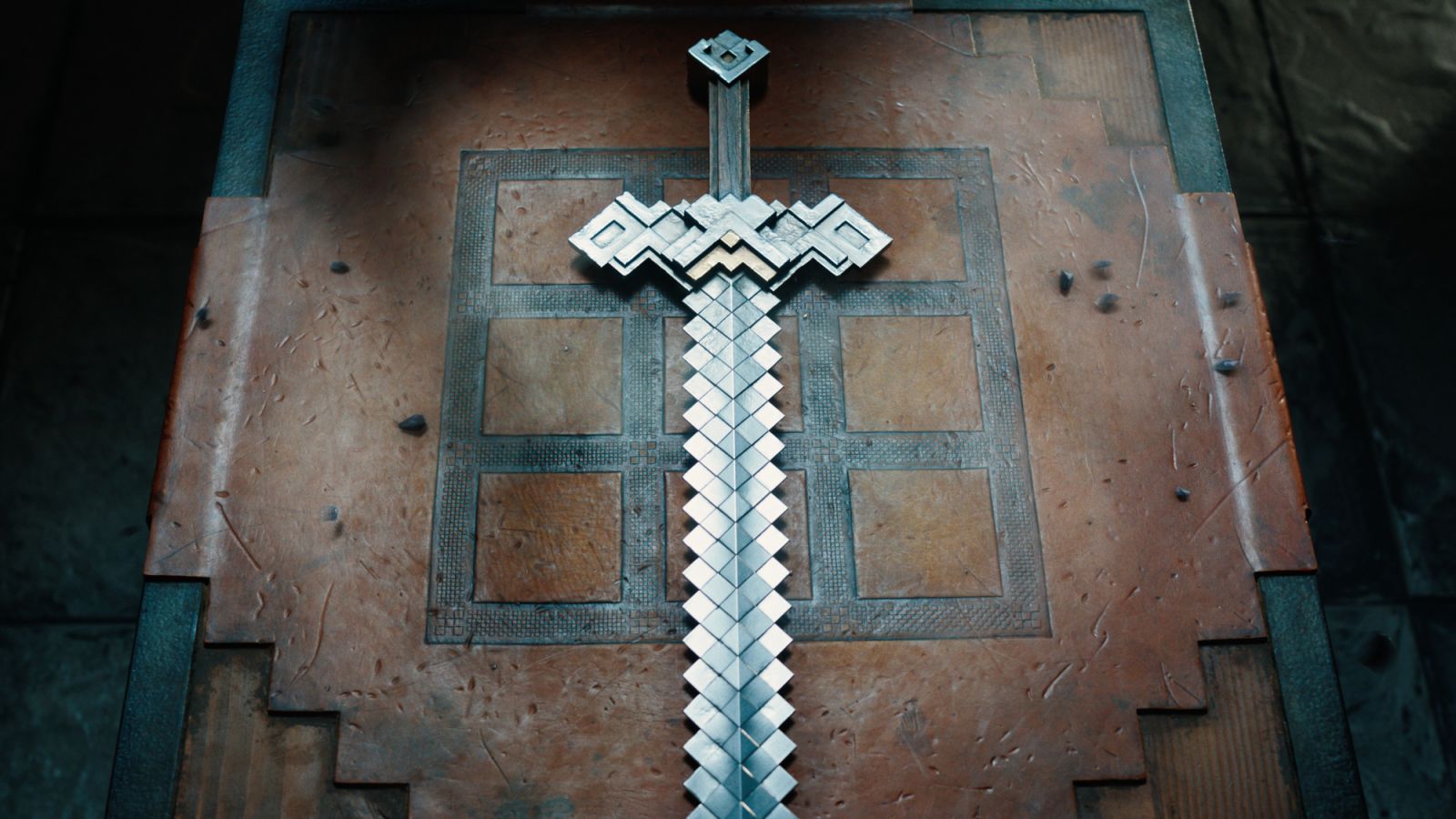 An iron sword on a crafting table (Photo: Courtesy of Warner Bros Pictures)