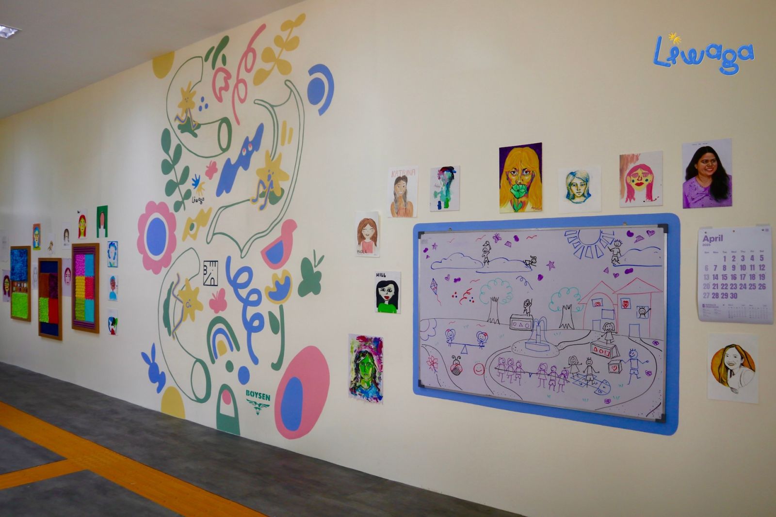 The entryway of the newly renovated boys' dormitory features a vibrant mural art installation created by Benilde interior design students