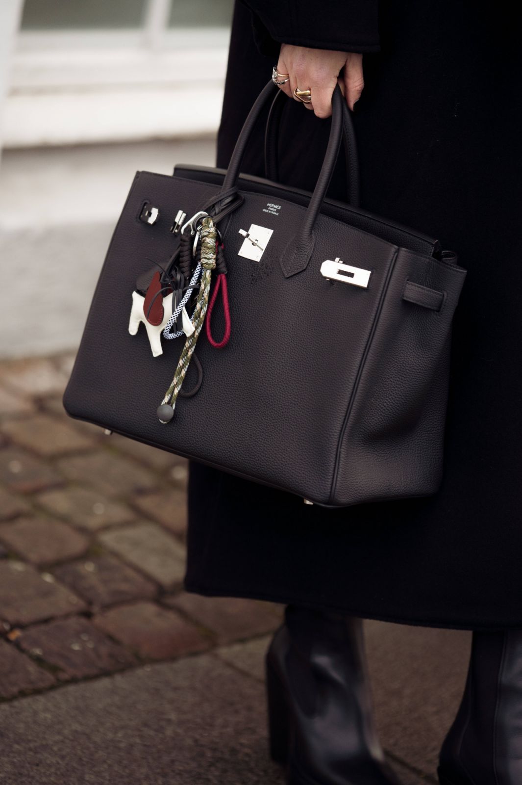 A woman holds the iconic Hermès Birkin at Copenhagen Fashion Week Autumn/Winter 2025 (Photo: Raimonda Kulikauskiene/Getty Images)