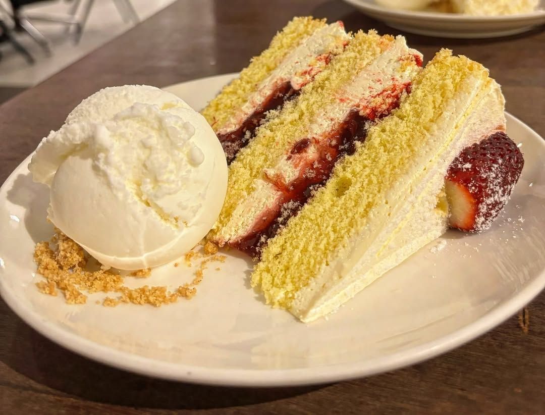 A slice of Nutmeg's Victoria Sponge Cake with ice cream (Photo: Instagram / @tastlytemptations_