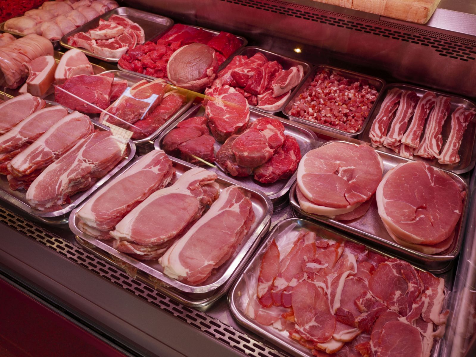 Fresh red meat in butcher shop, England, UK. (Photo by: Alex Segre/UCG/Universal Images Group via Getty Images)