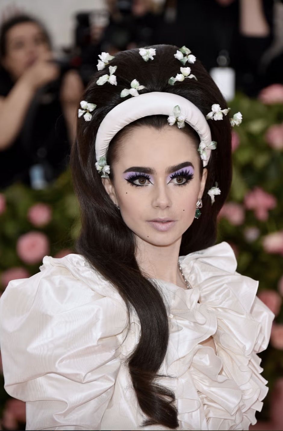 Lily Collins wears Giambattista Valli with hair styled by Gregory Russell to the 2019 Met Gala (Photo: Getty Images)