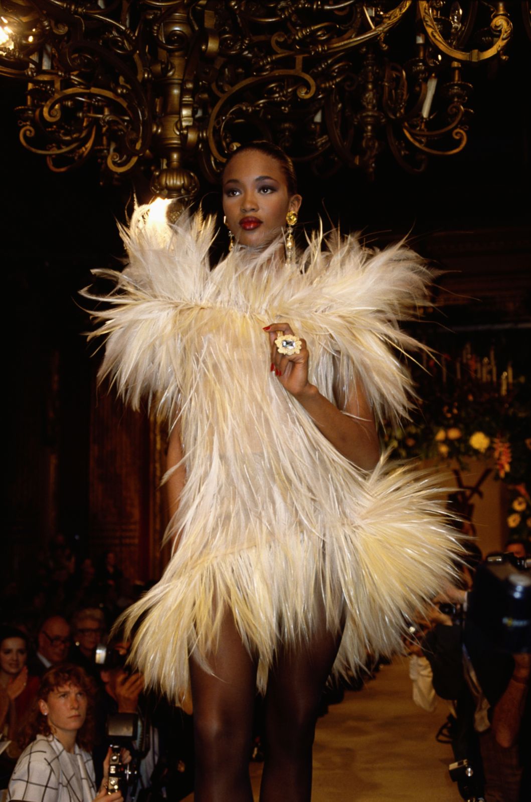 Fashion model Naomi Campbell wears a furry cocktail dress by French fashion designer Yves Saint Laurent at his autumn-winter 1987-1988 fashion show in Paris. Saint Laurent presented his women's haute couture collection at the show. (Photo by Pierre Vauthey/Sygma/Sygma via Getty Images)