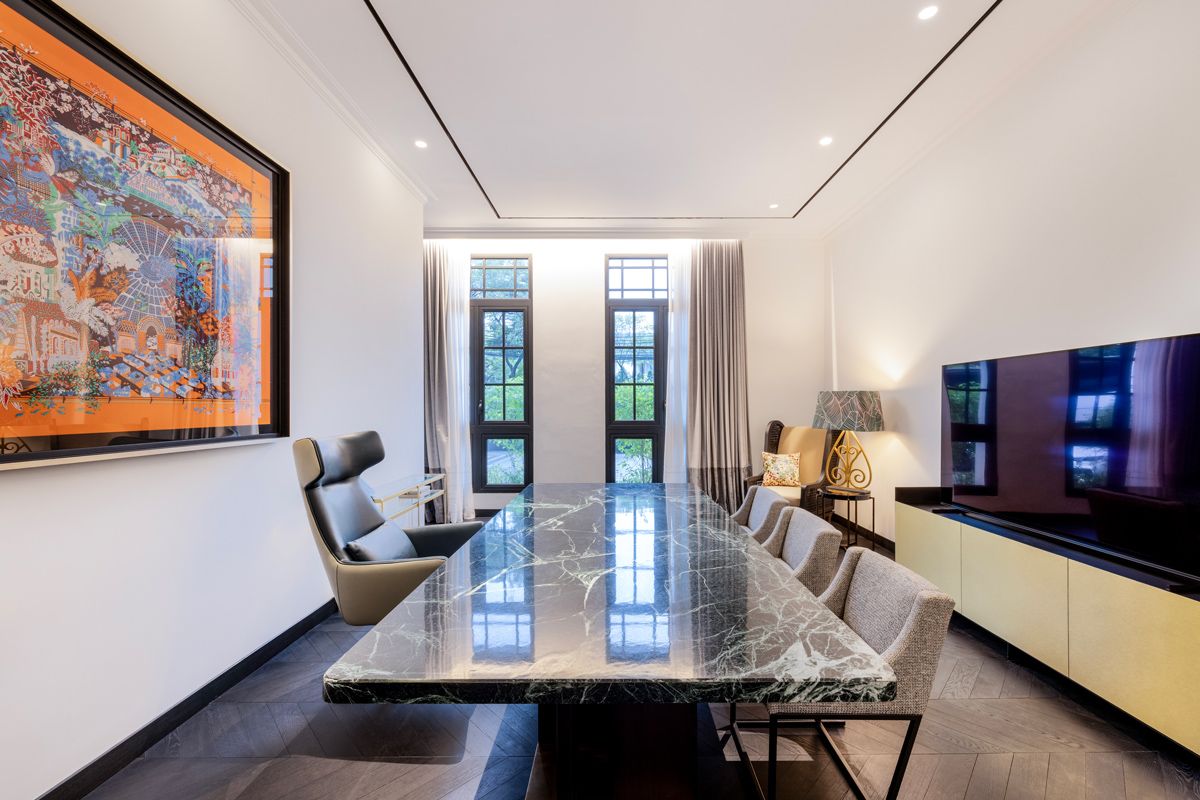 The handsomely furnished study features a Hermes scarf as an artwork
