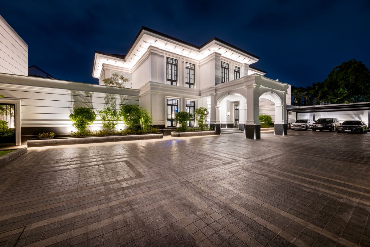 An evening exterior view of the landed home, which originally comprised two separate plots that were merged into one property