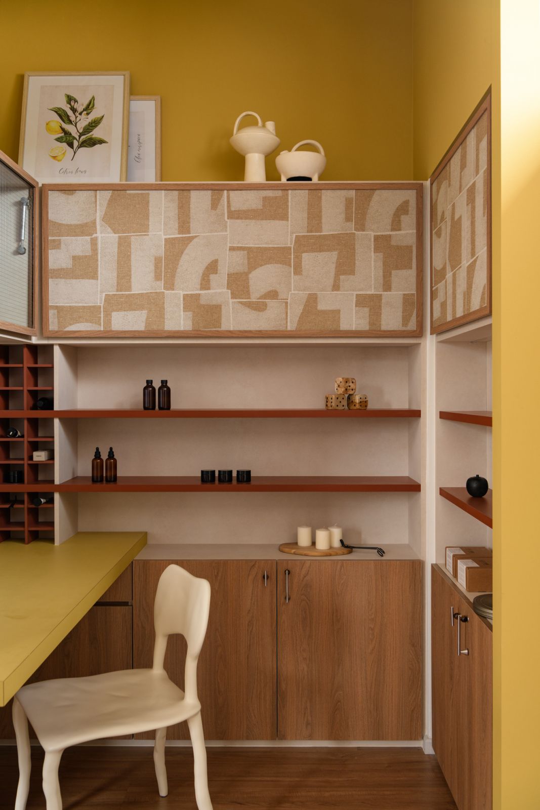 Bold yellow cabinetry transforms this workspace into a vibrant sanctuary, perfect for the homeowner’s aromatherapy practice