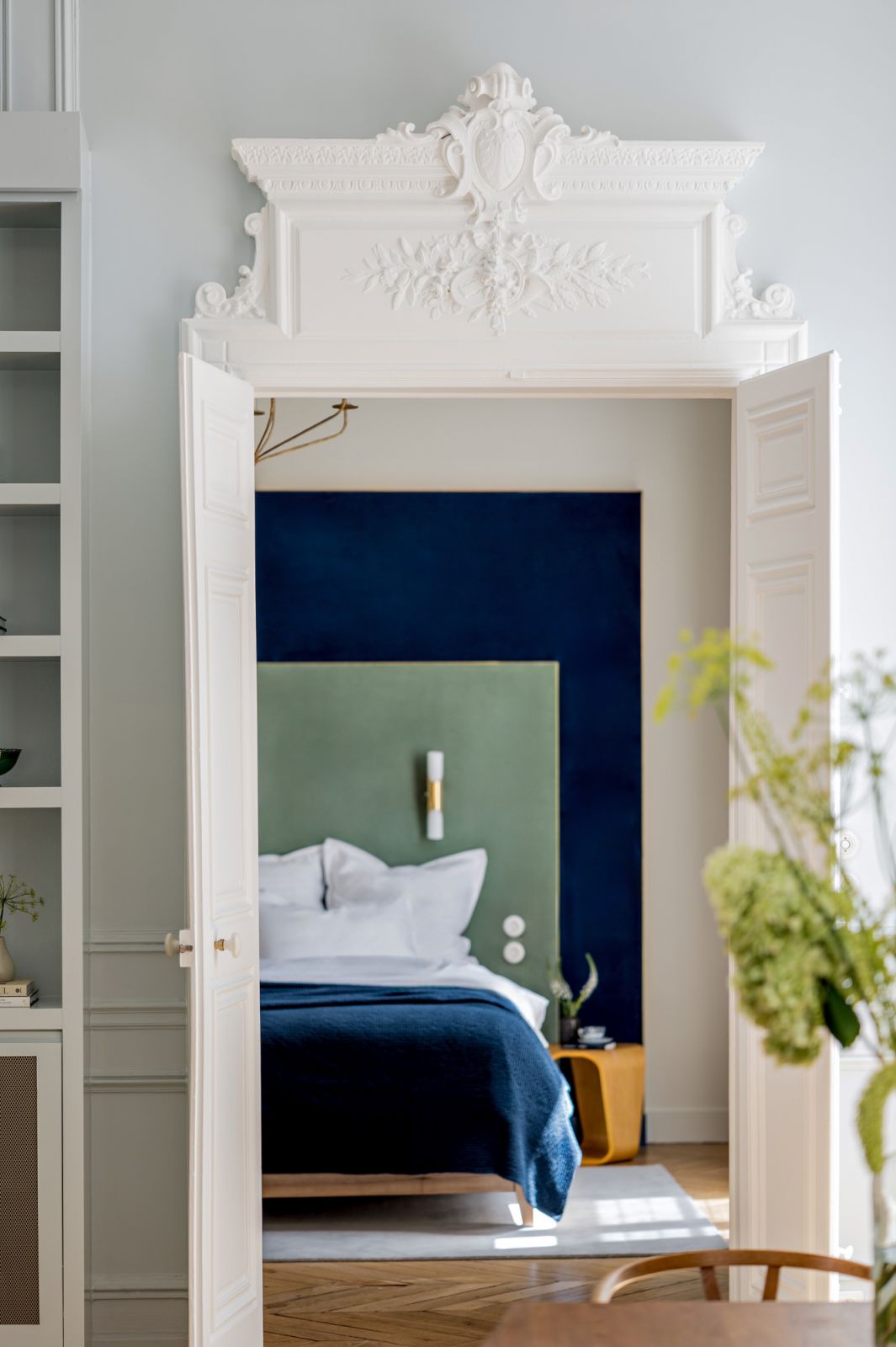 The master bedroom through the ornate architrave and French doors