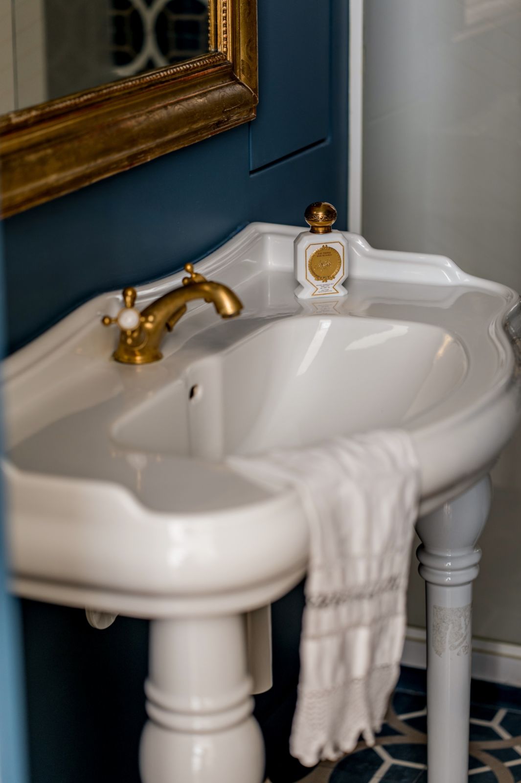 One of the bathrooms with fixtures reminiscent of the building’s illustrious past