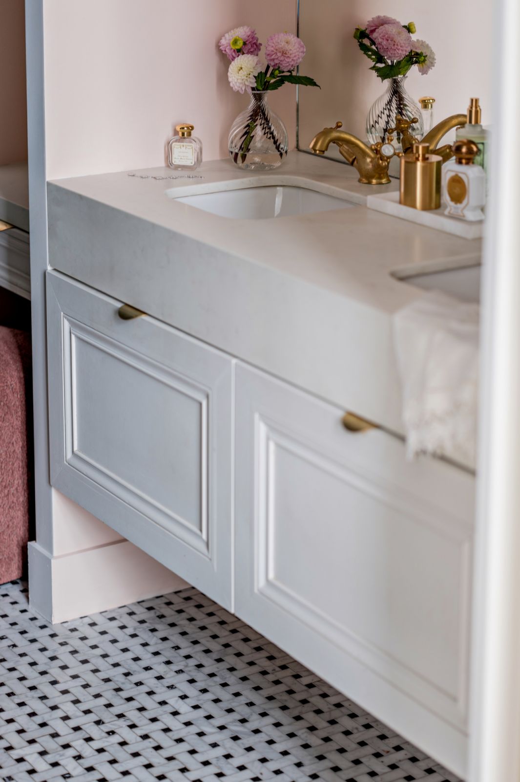 Another bathroom is fitted with a more contemporary vanity and colour