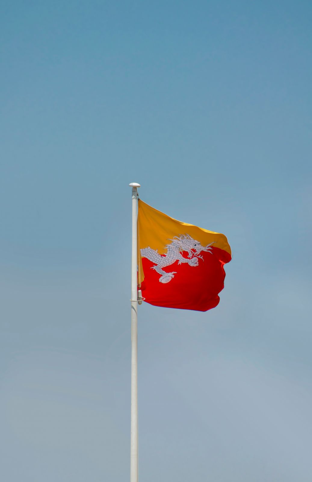 The flag of Bhutan (Photo: Aboodi Vesakaran via Unsplash)