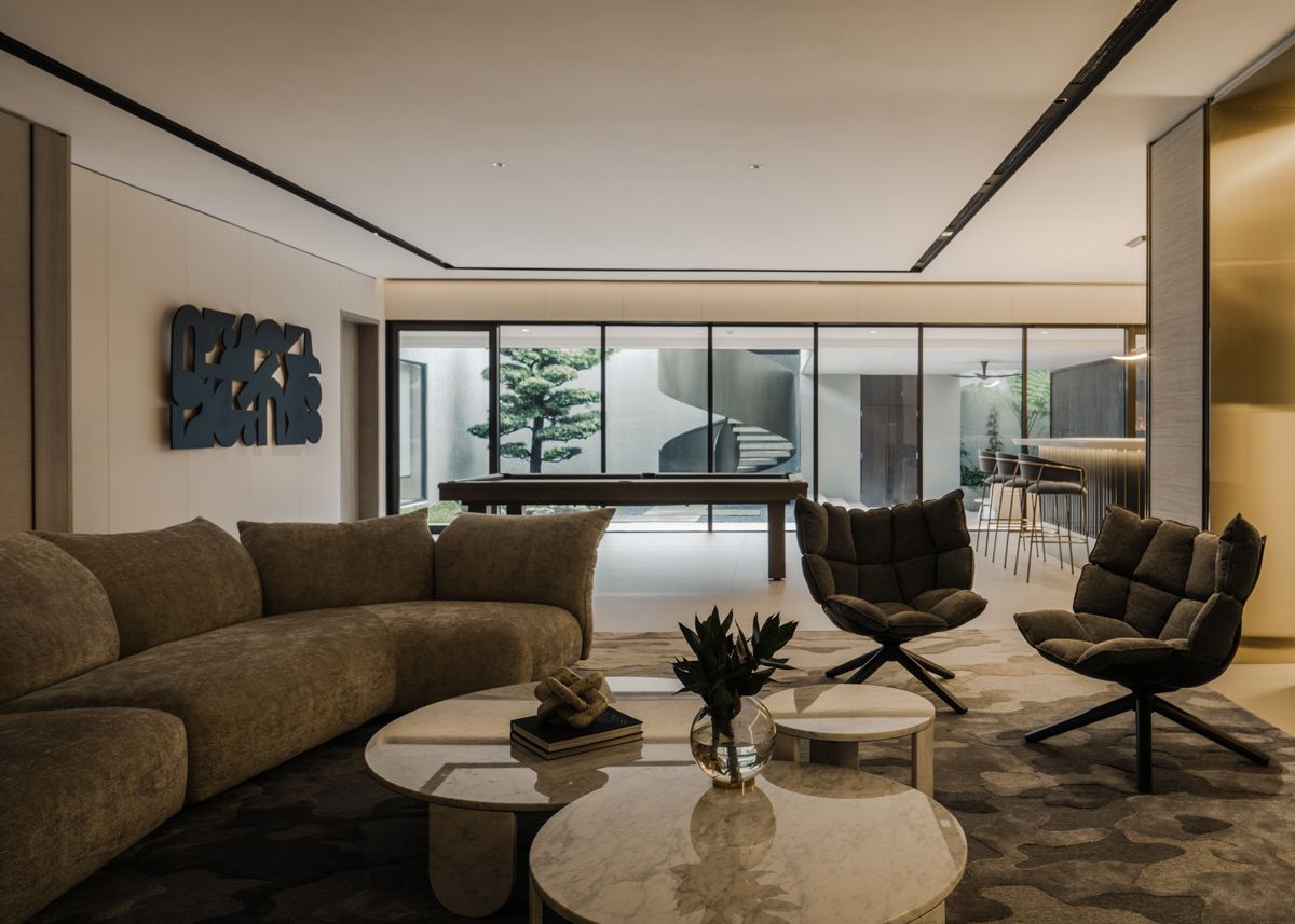 The Good Class Bungalow's basement lounge receives plenty of natural light courtesy of its expansive glazing
