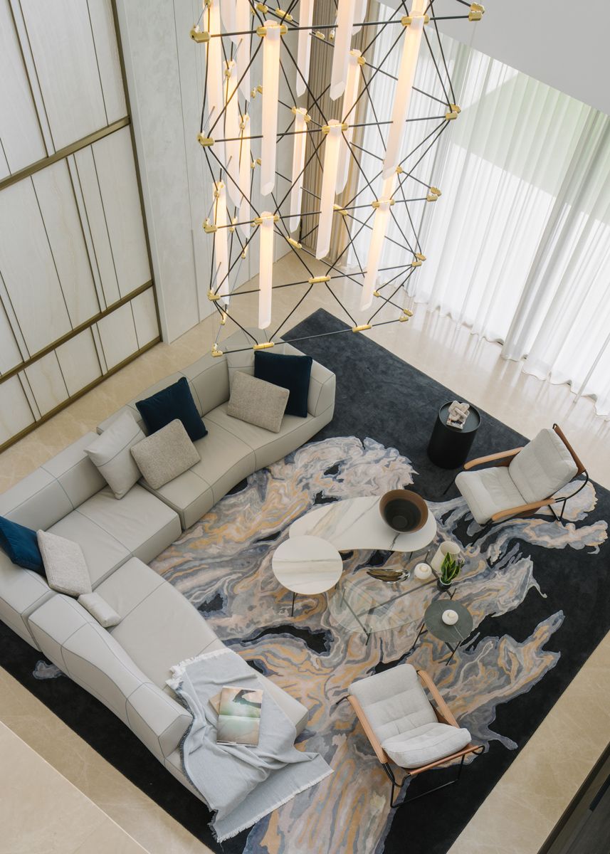The double height living room is adorned with a Trio Mozaik chandelier by French brand Designheure