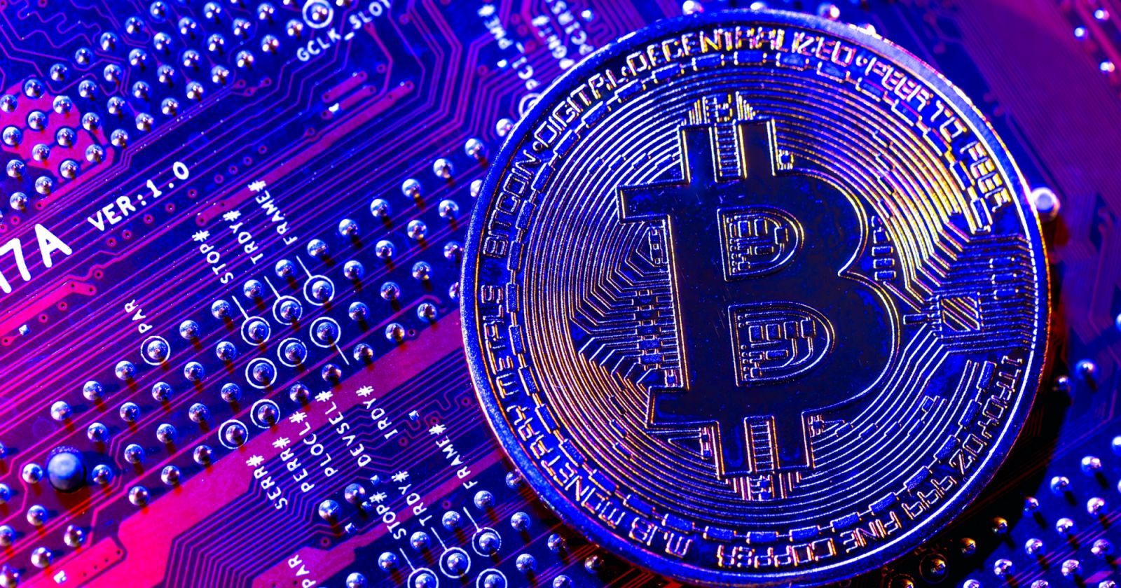 Bitcoin coin close-up on circuit board. Finance concept. High quality photo
