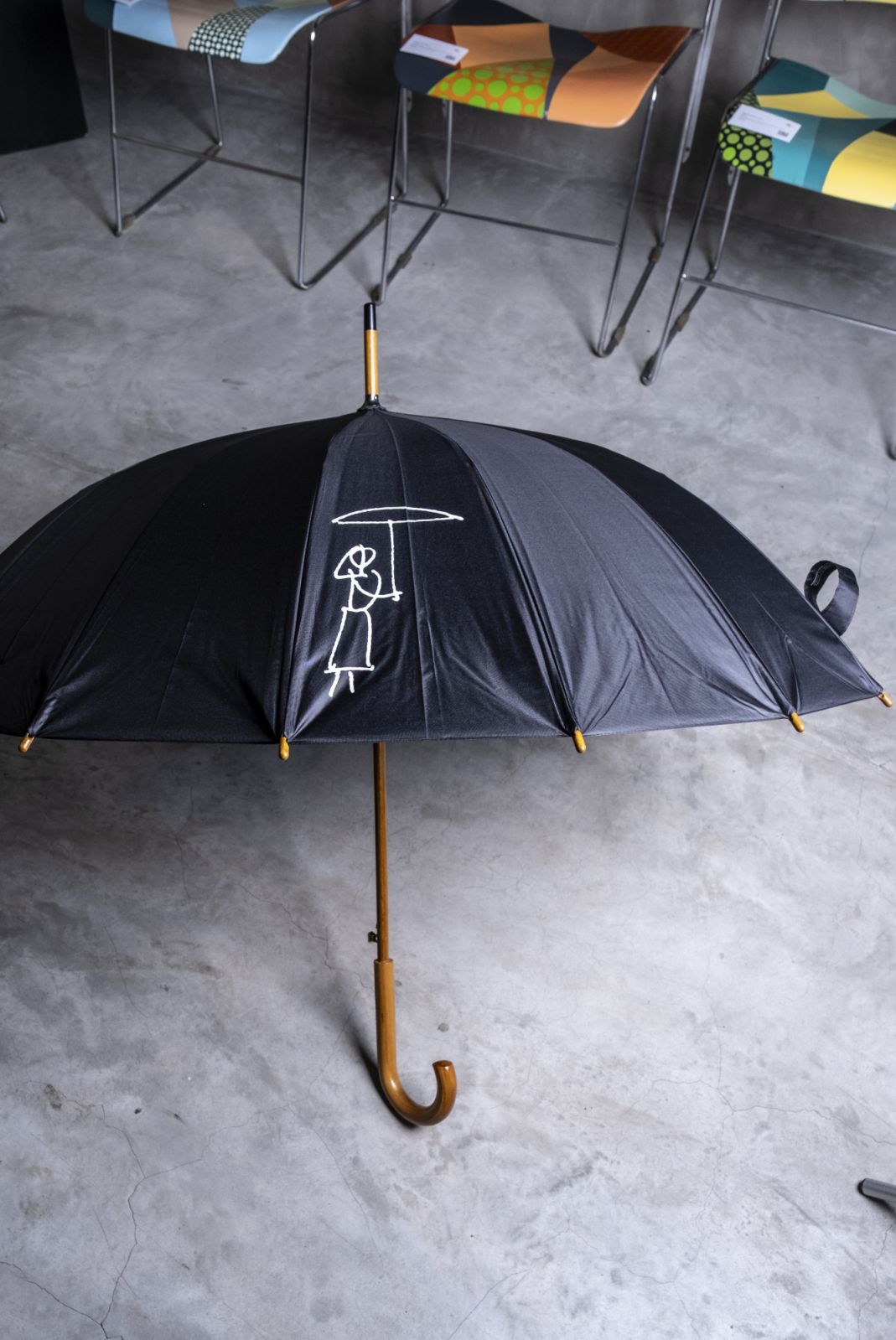 The opened Japanese umbrella features Batac Funeral (Photo: Before Deadlines)