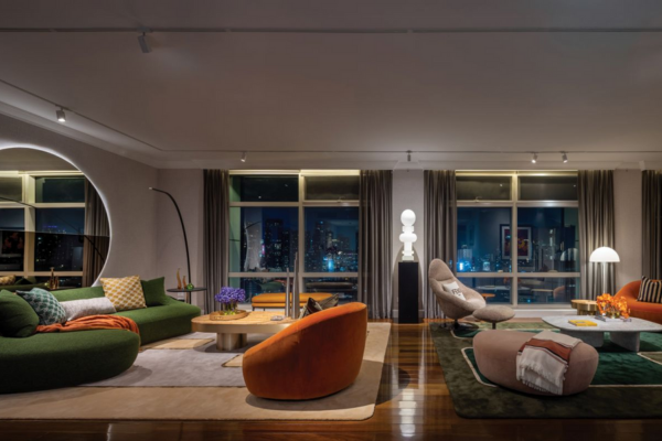 Designed by Studio BDJ, the living room of this penthouse flows in quiet harmony—framing the city in every direction (Photo: Studio Synthesis)