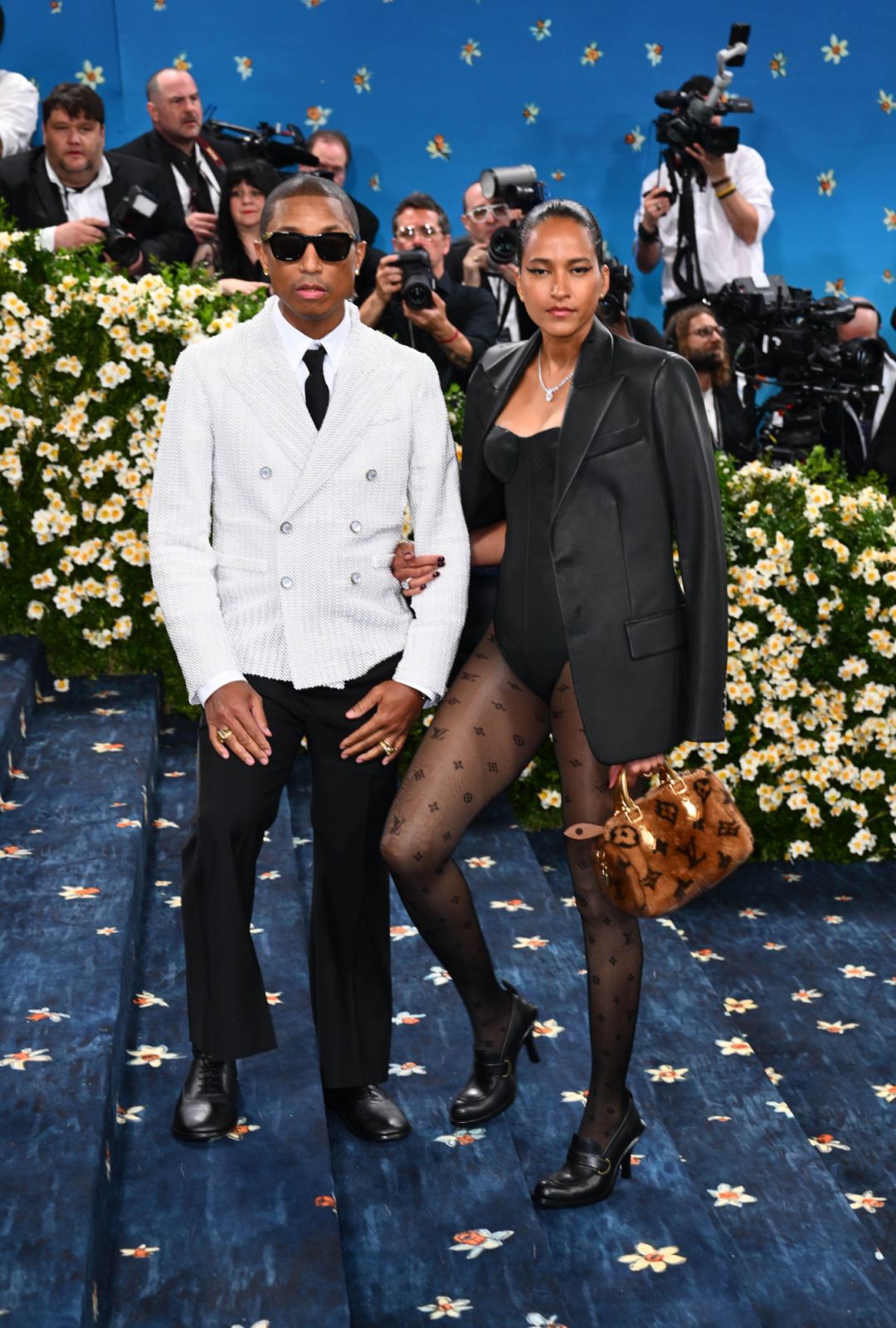 Pharrell Williams and Helen Lasichanh (Photo: courtesy of Matt Crossick/PA Images via Getty Images)