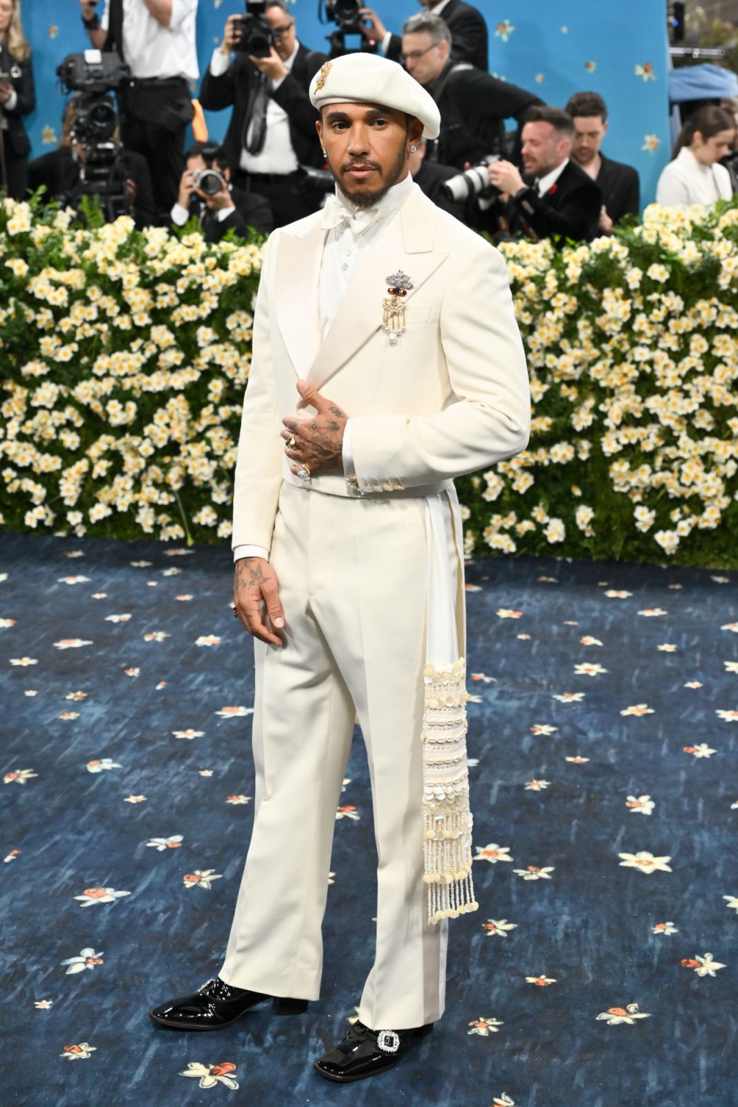 Lewis Hamilton wearing jewellery made of cowrie shells and freshwater pearls (Photo: courtesy of Michael Buckner/Penske Media via Getty Images)