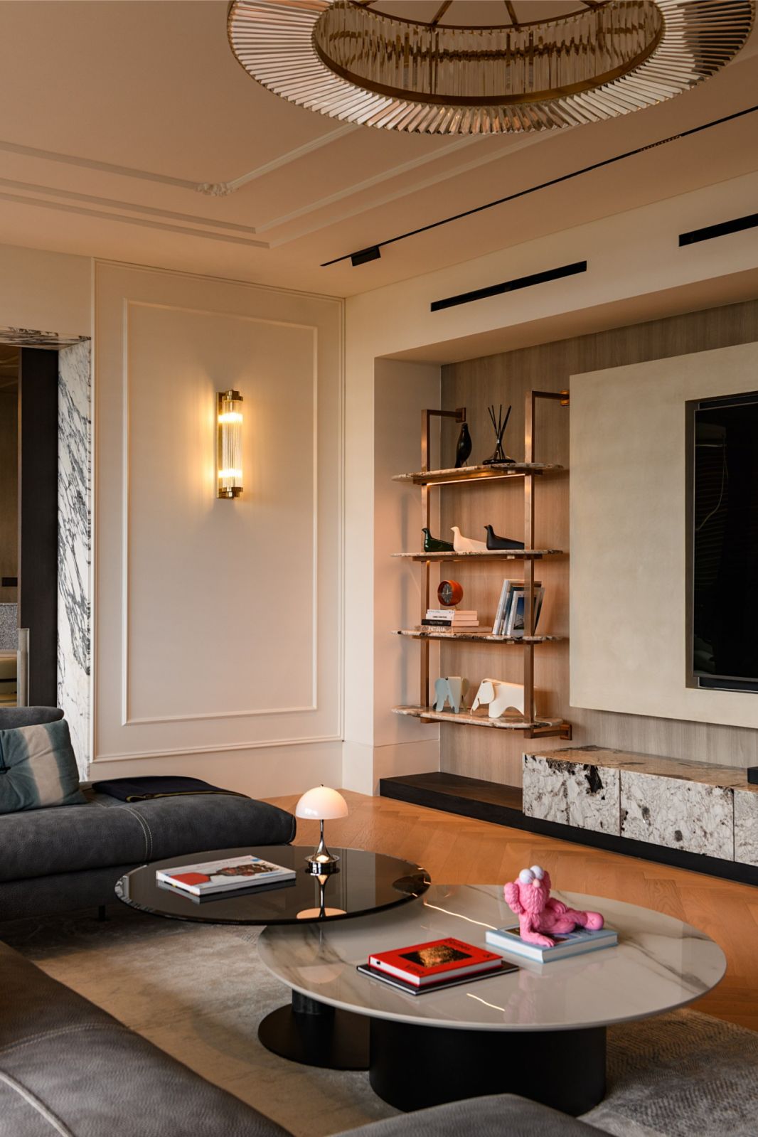 Elegant living room showcasing custom lighting, designer coffee tables and floating media wall in this Kuala Lumpur luxury residence
