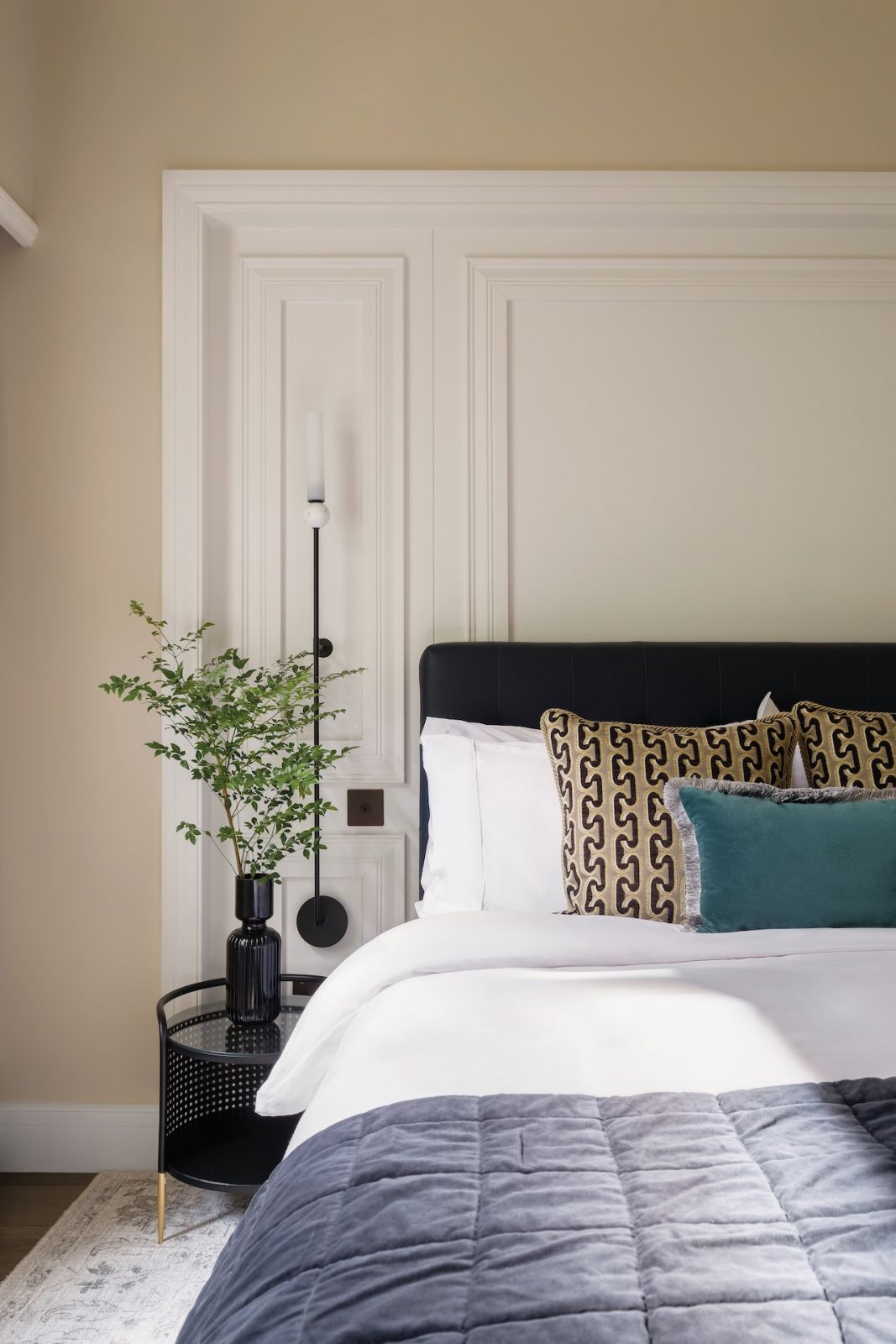 Eco-friendly elements, such as bamboo silk bedding for soft and breathable comfort are present in this guest bedroom