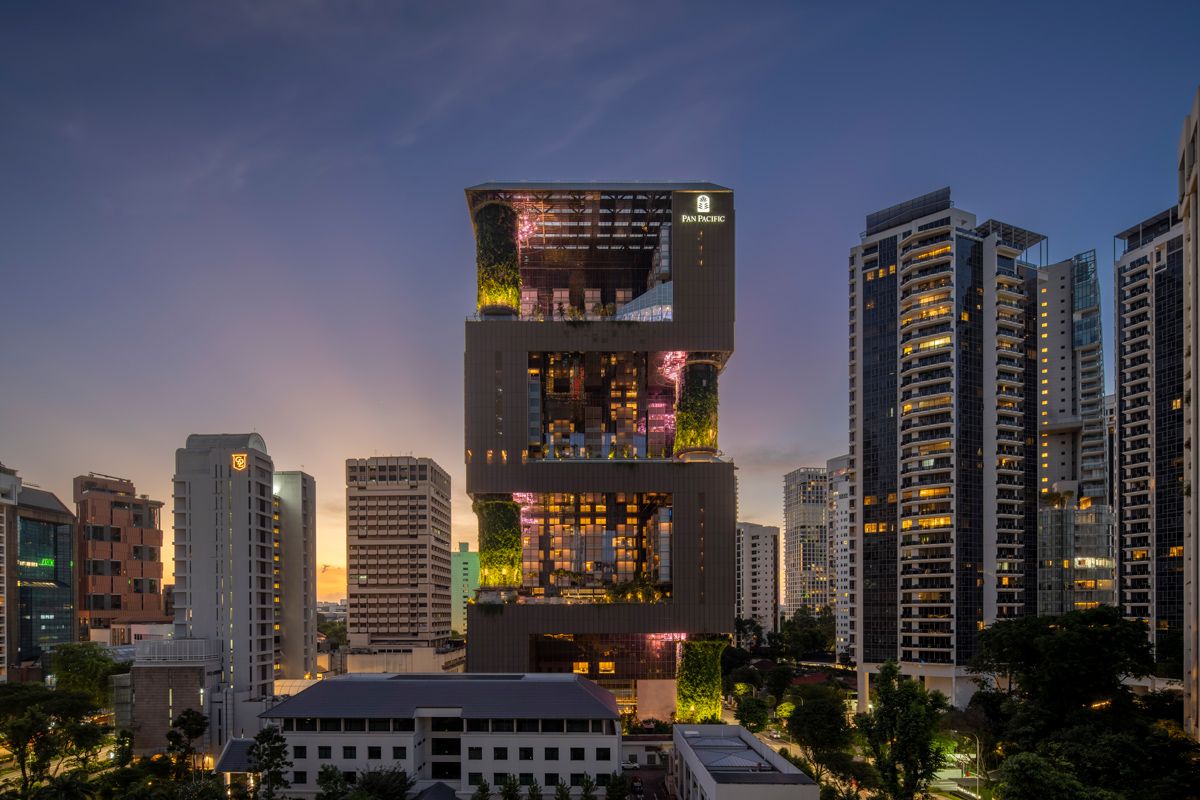 An evening view of Pan Pacific Orchard’s lush, sky-garden-stacked architecture—designed by Woha as a biophilic high-rise that redefines vertical sustainability in the Global South (Photo: Darren Soh)