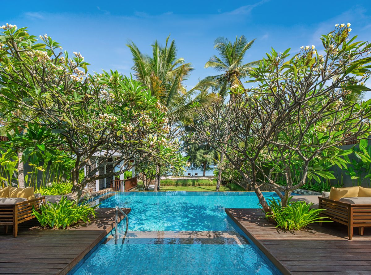 Lush greenery surrounds the poolscape at The Sira on Lombok