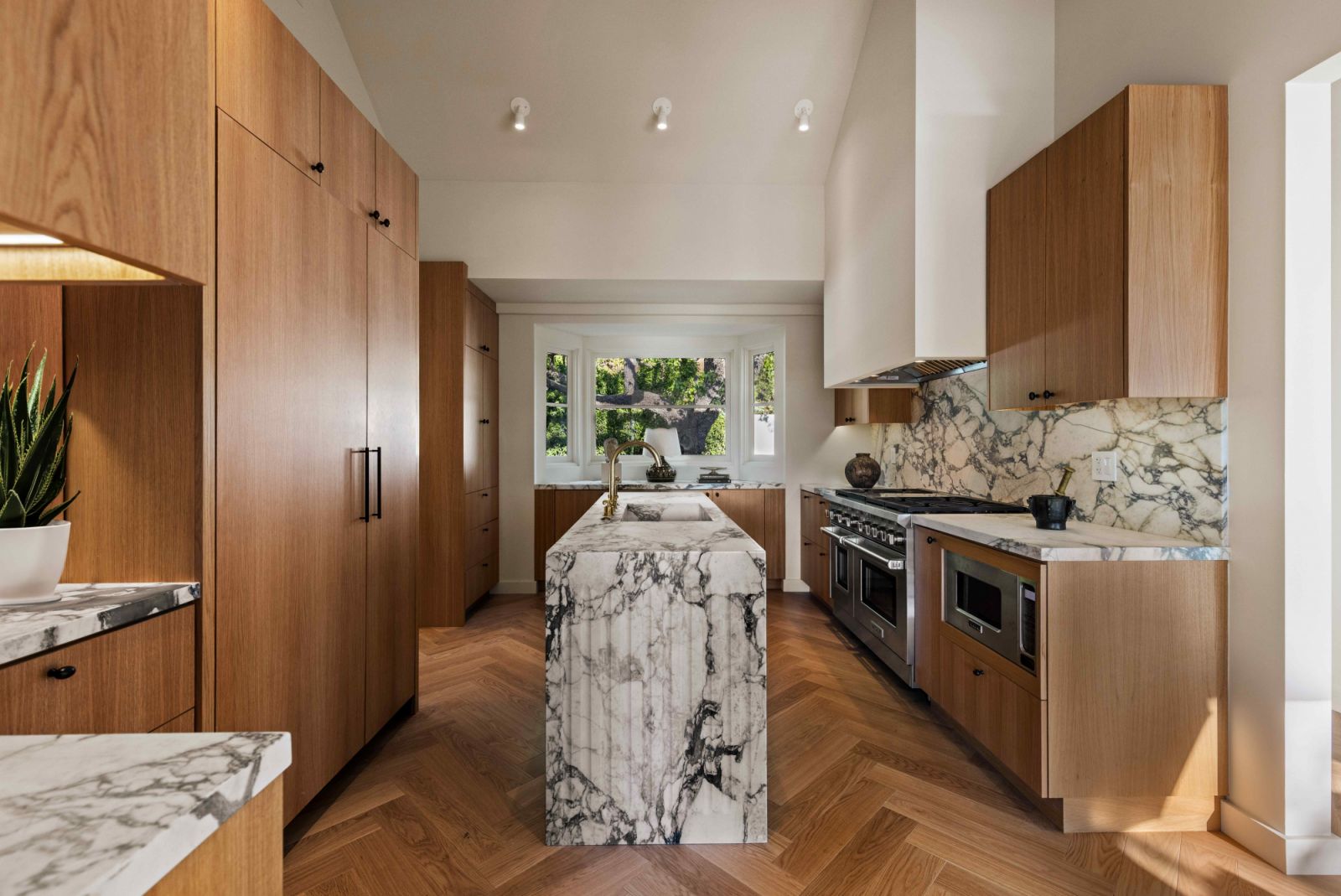 Herringbone oak flooring anchors the kitchen with warmth (Photo: Sam Frost)