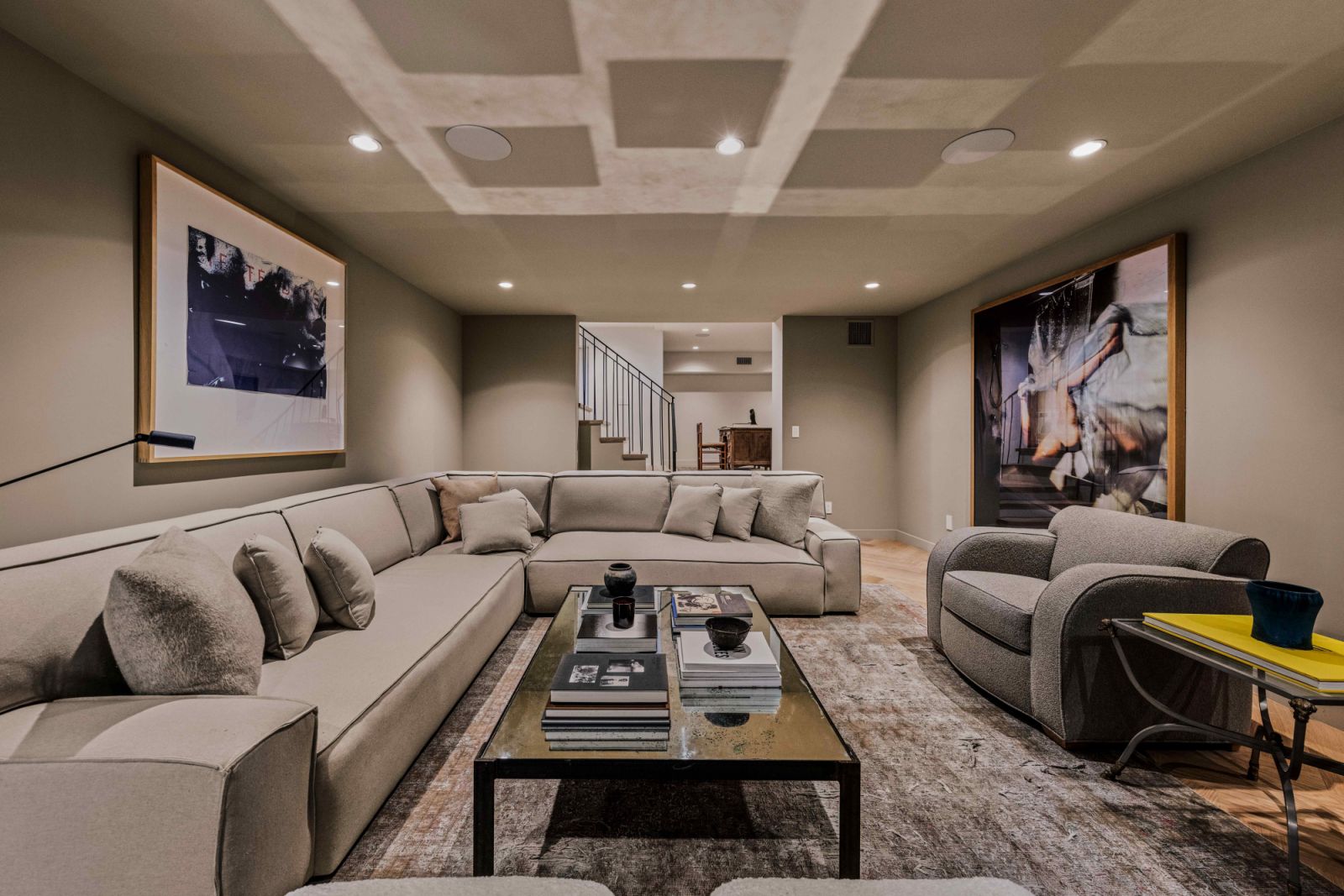 The television room in the built-out basement with a custom-built banquette
