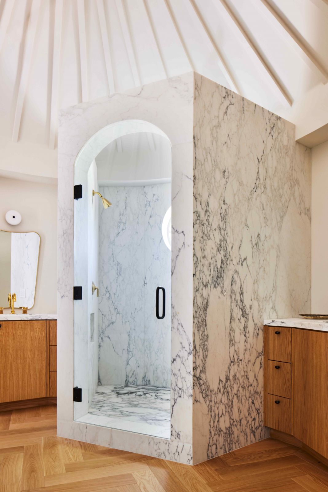 The shower area is wrapped in Calcatta Gold marble (Photo: Sam Frost)