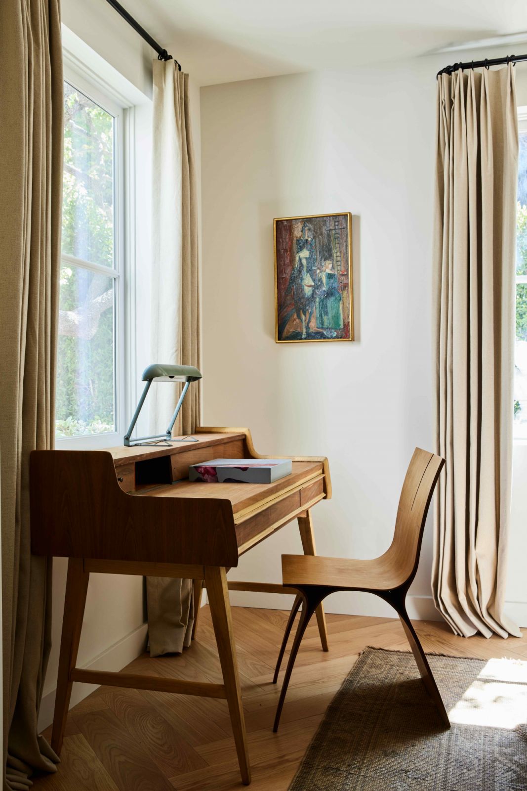 A Charlotte Perriand desk lamp on the Gio Ponti writing desk (Photo: Sam Frost)
