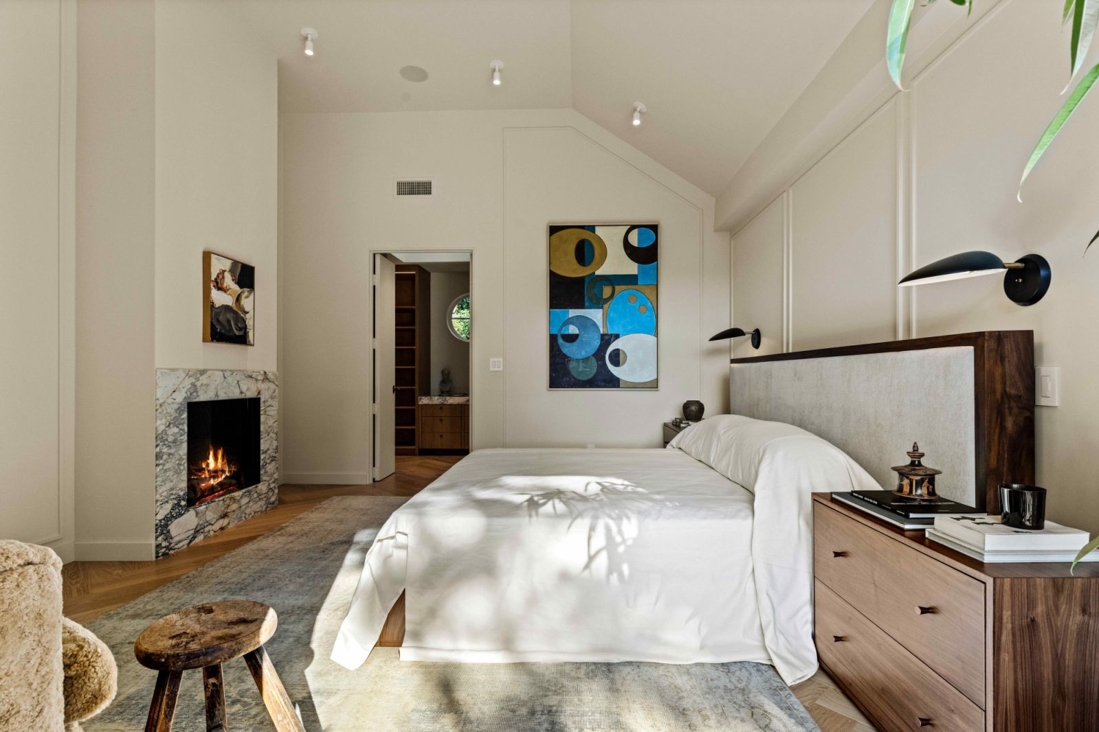 The high-ceilinged master bedroom suite