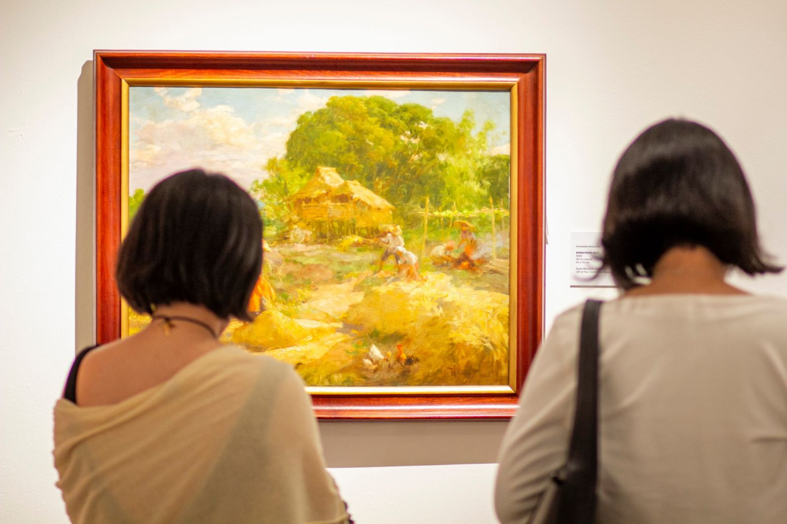 ‘Winnowing Rice’, 1949, Oil on canvas, 55 x 70 on display at the ‘Amorsolo: Chroma’ exhibition (Photo: courtesy of Ayala Museum)