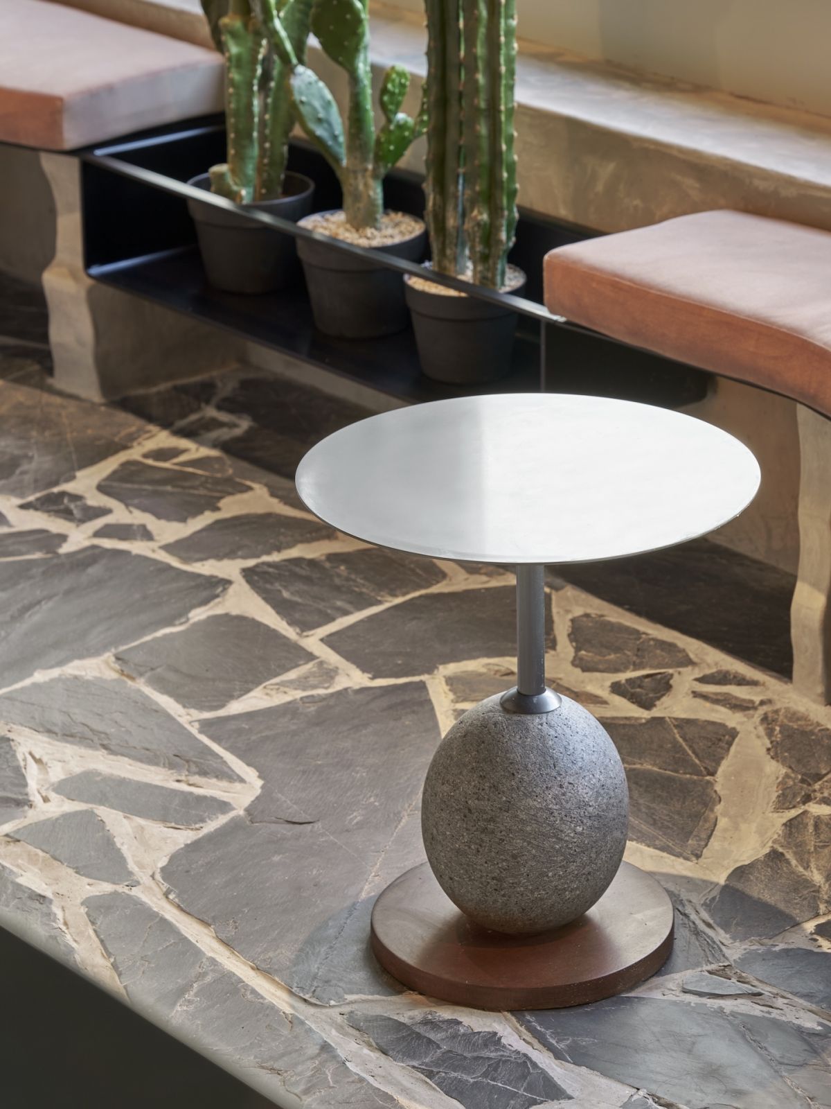 Volcanic stone, refined metal and wood table by Dalisay Collection