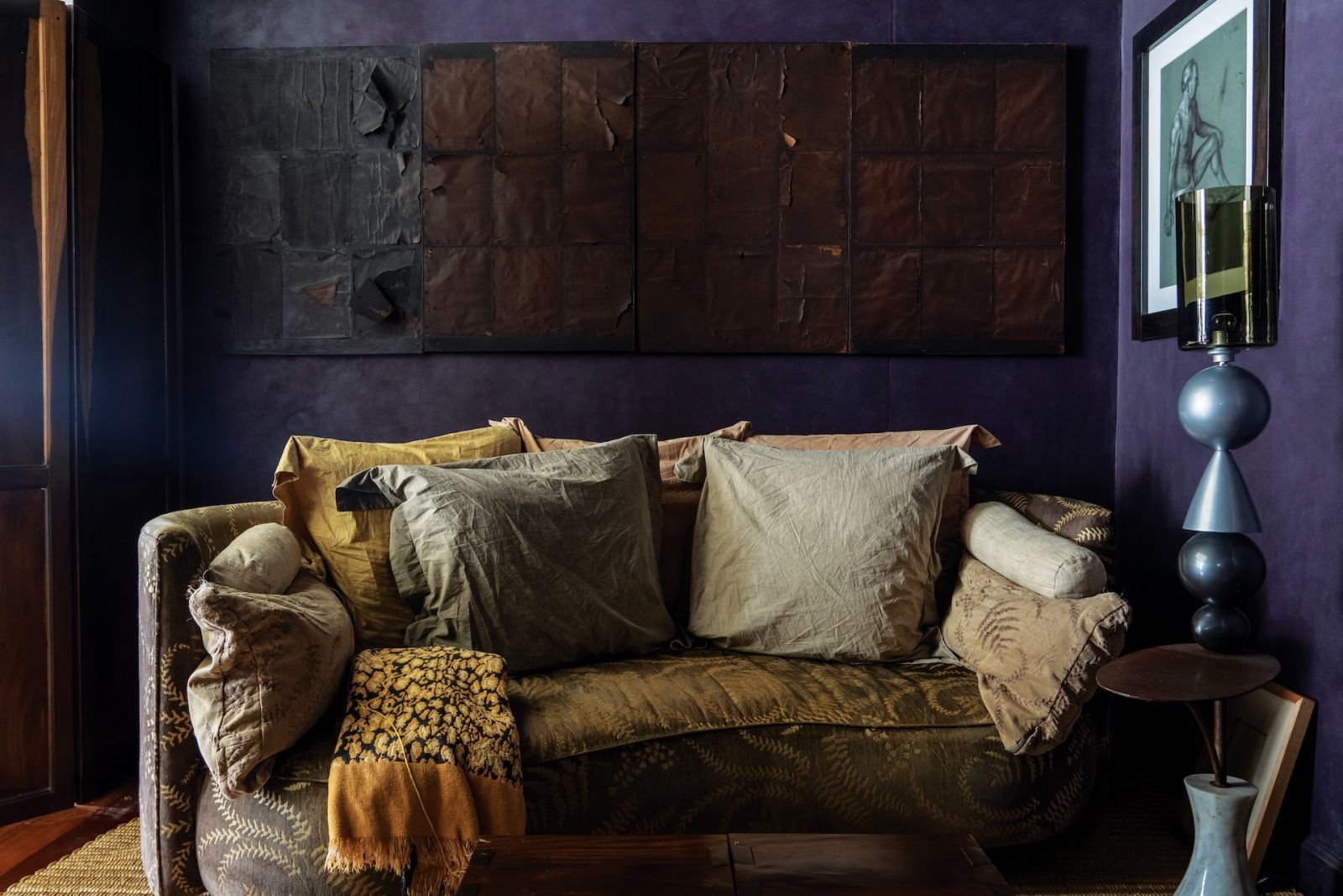 The four black paintings on the walls are part of Yola Johnson’s early works