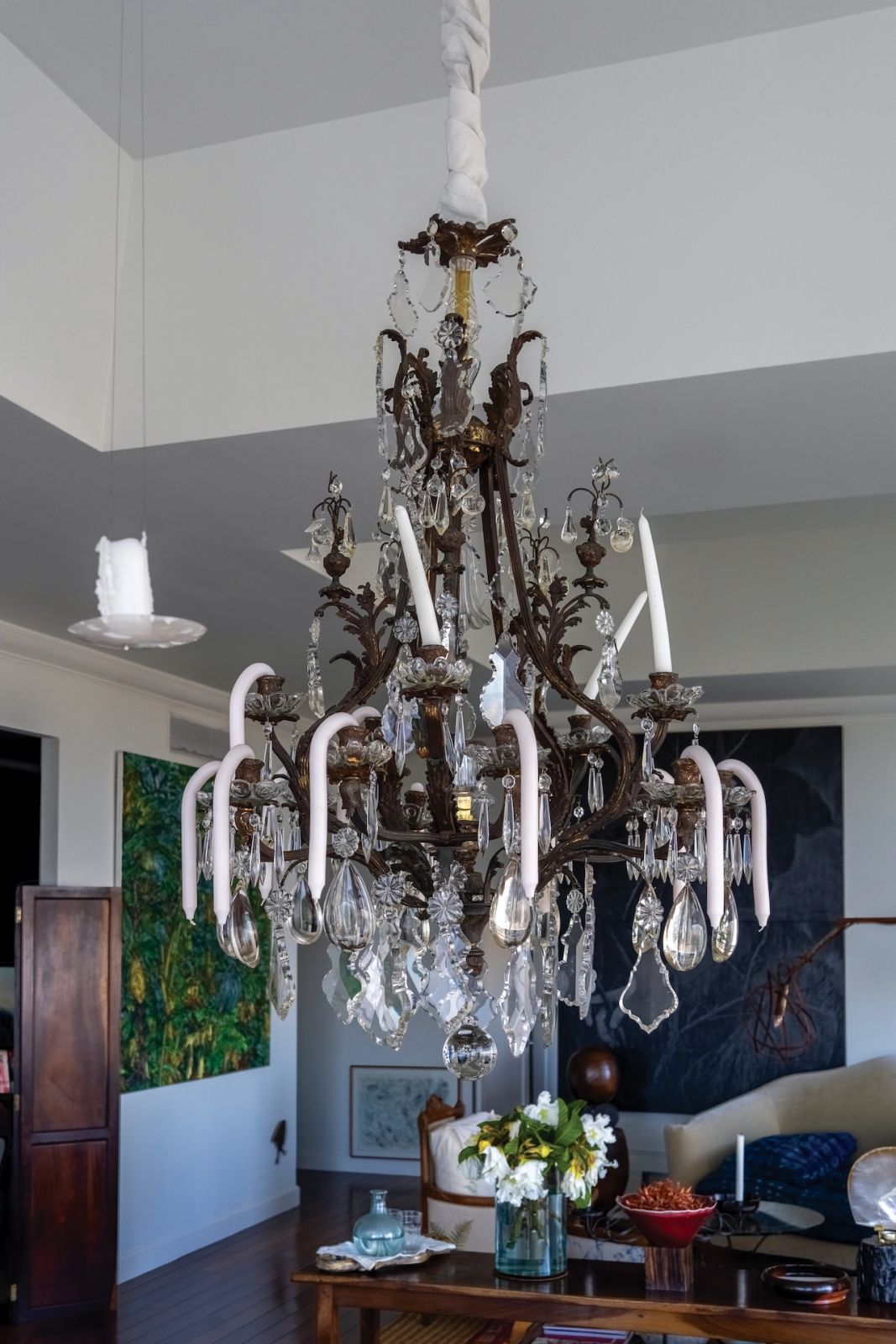 Melted candles add charm to this traditional chandelier in Yola Johnson's home