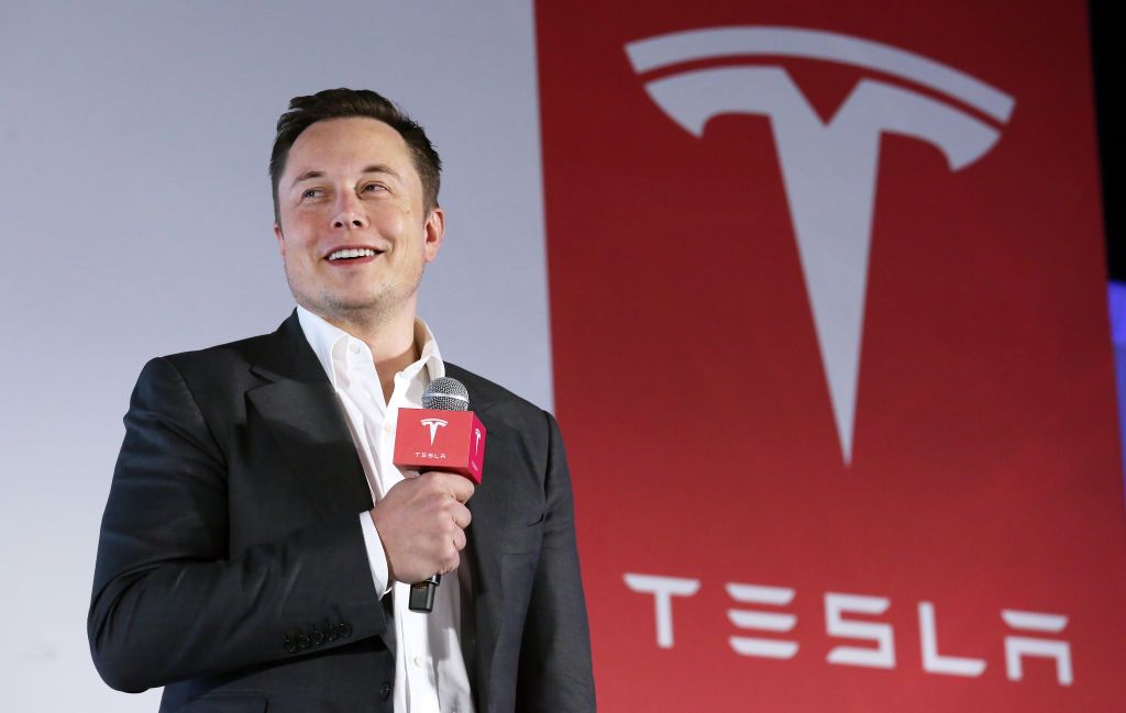 Tesla Motors CEO Elon Musk speaks to the media next to its Model S during a press conference in Hong Kong. 25JAN16 SCMP/ Nora Tam (Photo by Nora Tam/South China Morning Post via Getty Images)