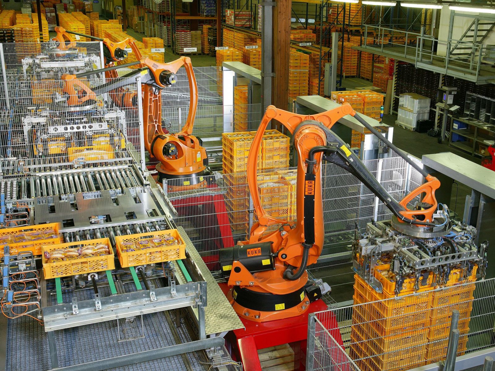 Industrial robots for palletizing food products like bread and toast at a bakery in Germany (Photo: Wikimedia Commons, KUKA AG)