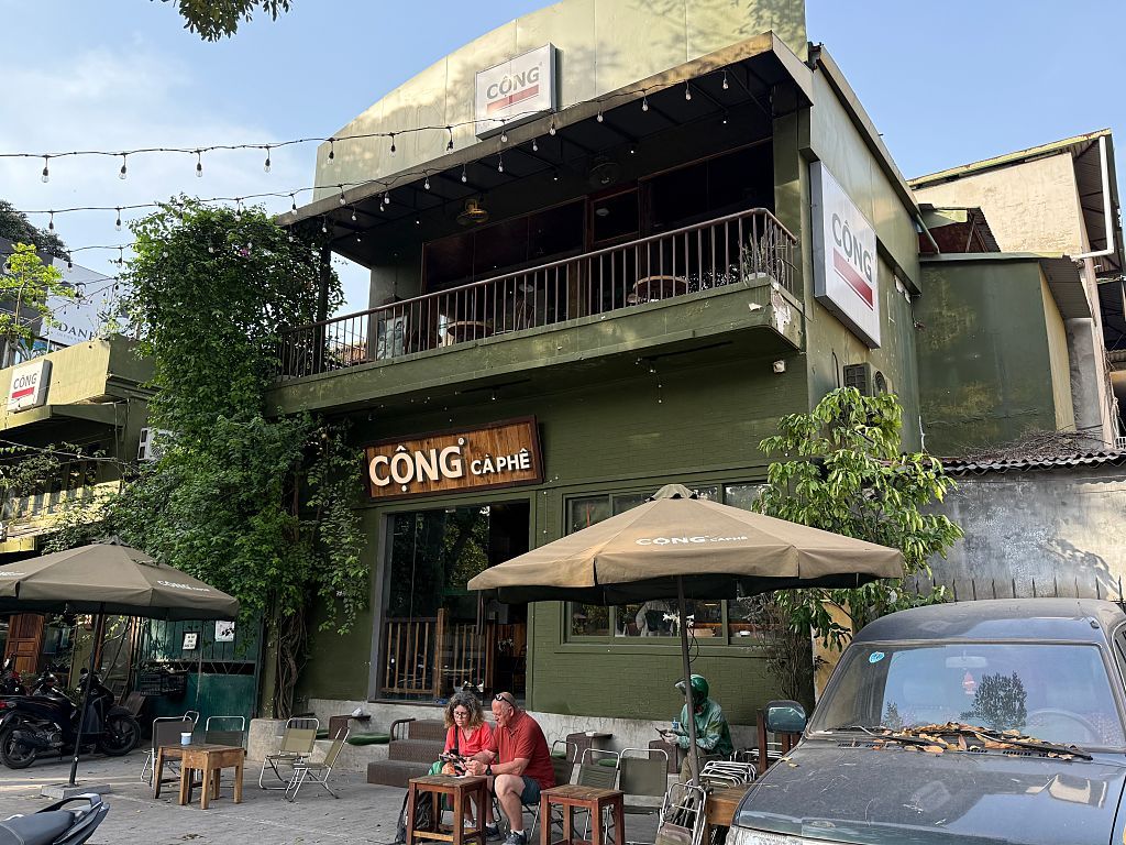 14 April 2025, Vietnam, Hanoi: Cong Caphe is a large Vietnamese café chain. Its trademark is a khaki-green exterior and waiters and waitresses in Viet Cong outfits. Photo: Carola Frentzen/dpa (Photo by Carola Frentzen/picture alliance via Getty Images)