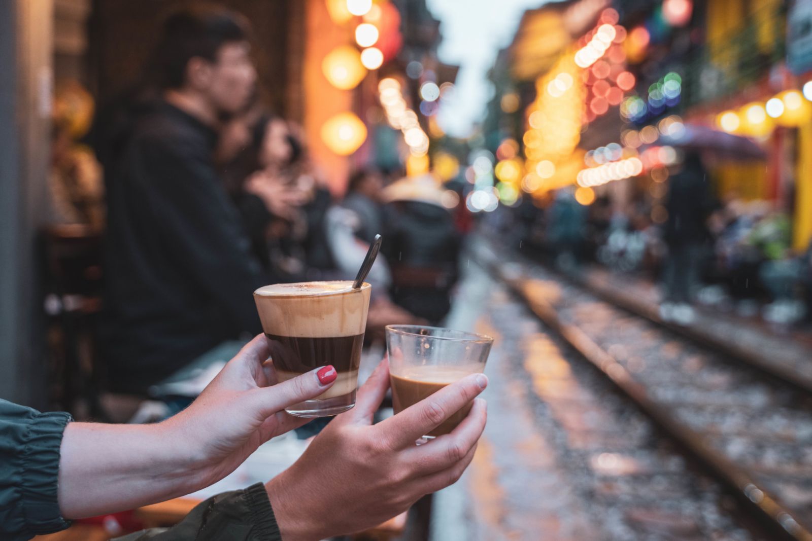 Coffee cups on the railway tracks between houses in Hanoi
