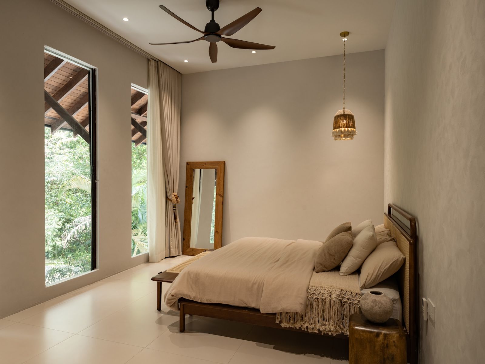 A serene retreat where the walk-in wardrobe leads into the main sleeping quarters, creating a fluid, private sanctuary for the homeowners