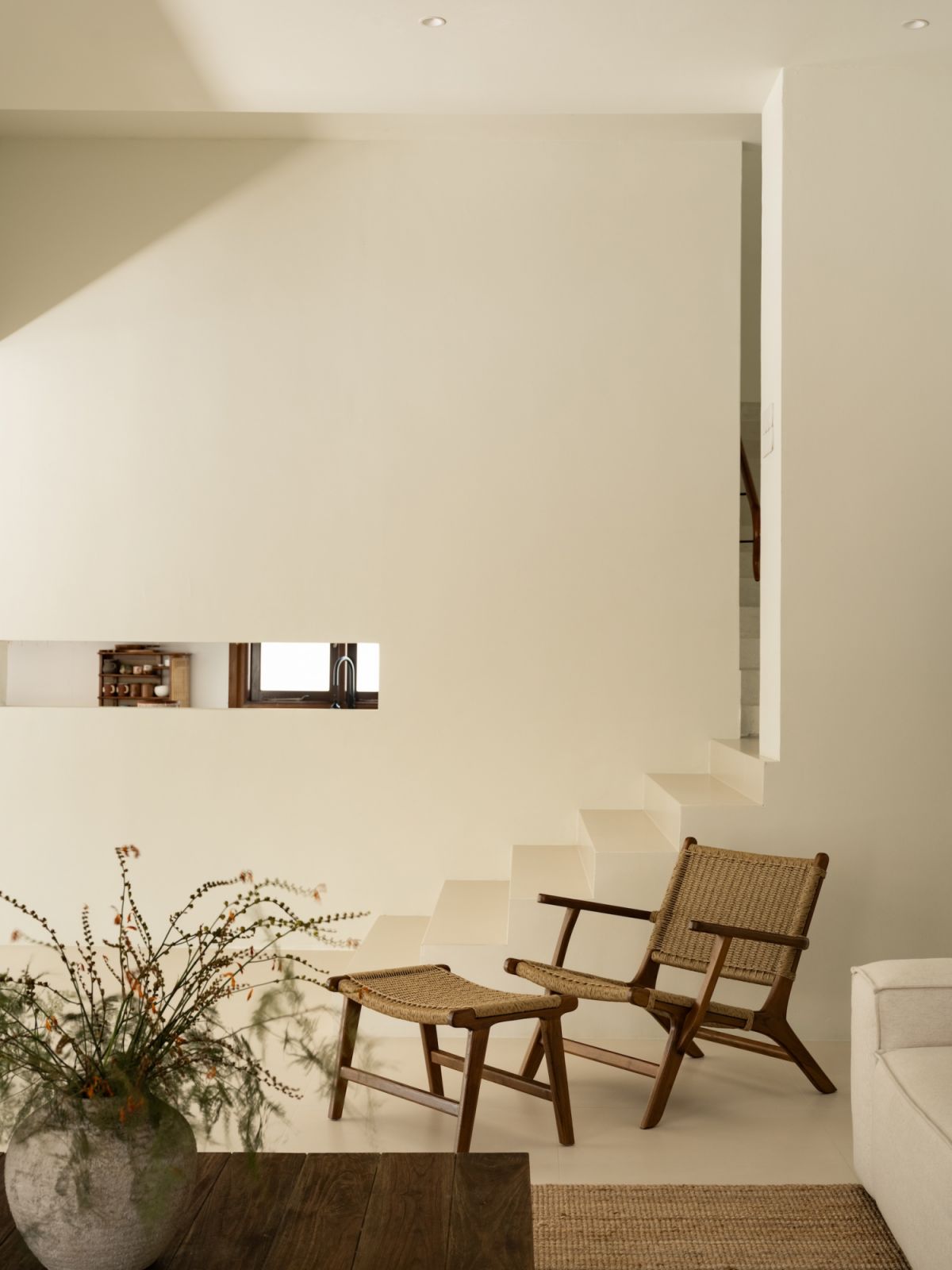 The Mediterranean-inspired residence combines organic textures with an open-plan layout
