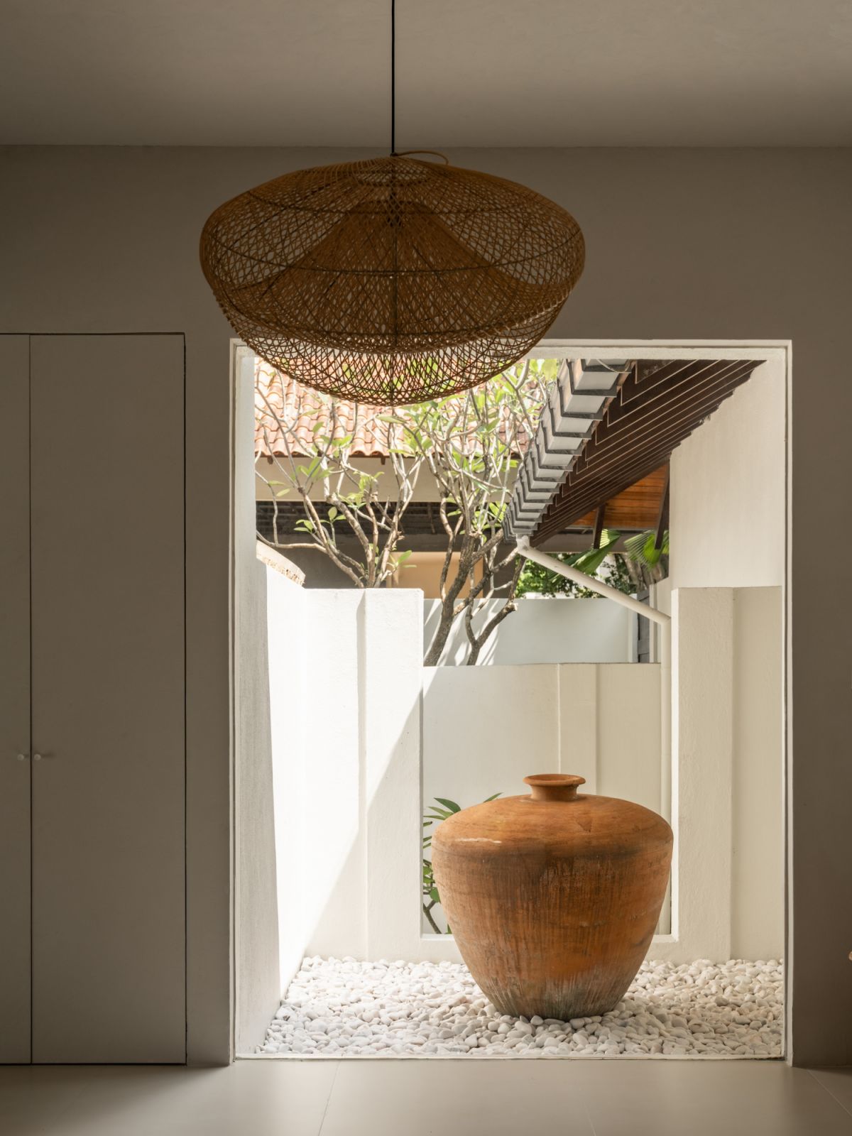 This tranquil courtyard space embodies the home’s commitment to blending indoor and outdoor living