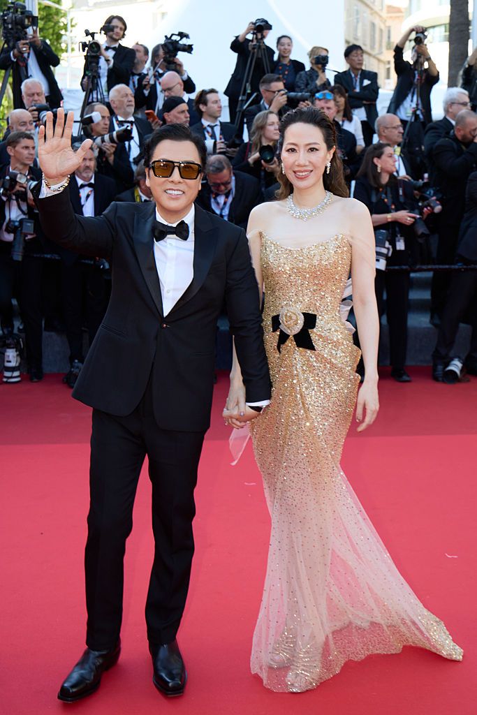 CANNES, FRANCE - MAY 15: Actor Donnie Yen Chi-tan and his wife Cissy Wang (aka Cecilia Wang Shi Shi) attend the "Dossier 137" (Case 137)" red carpet during the 78th annual Cannes Film Festival at Palais des Festivals on May 15, 2025 in Cannes, France. (Photo by VCG/VCG via Getty Images)